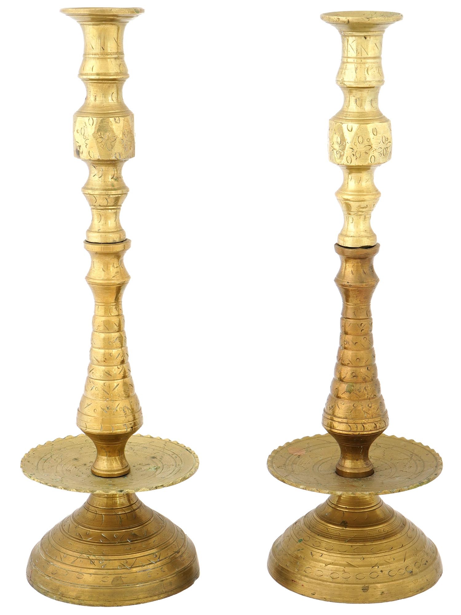 VINTAGE MOROCCAN BRONZE CANDLE HOLDERS CA 1950: A pair of vintage bronze candle holders, each featuring a decorative, handcrafted design, presumably of Moroccan origin, circa the 1950s. The candle holders have a wide, flared base with engraved patt