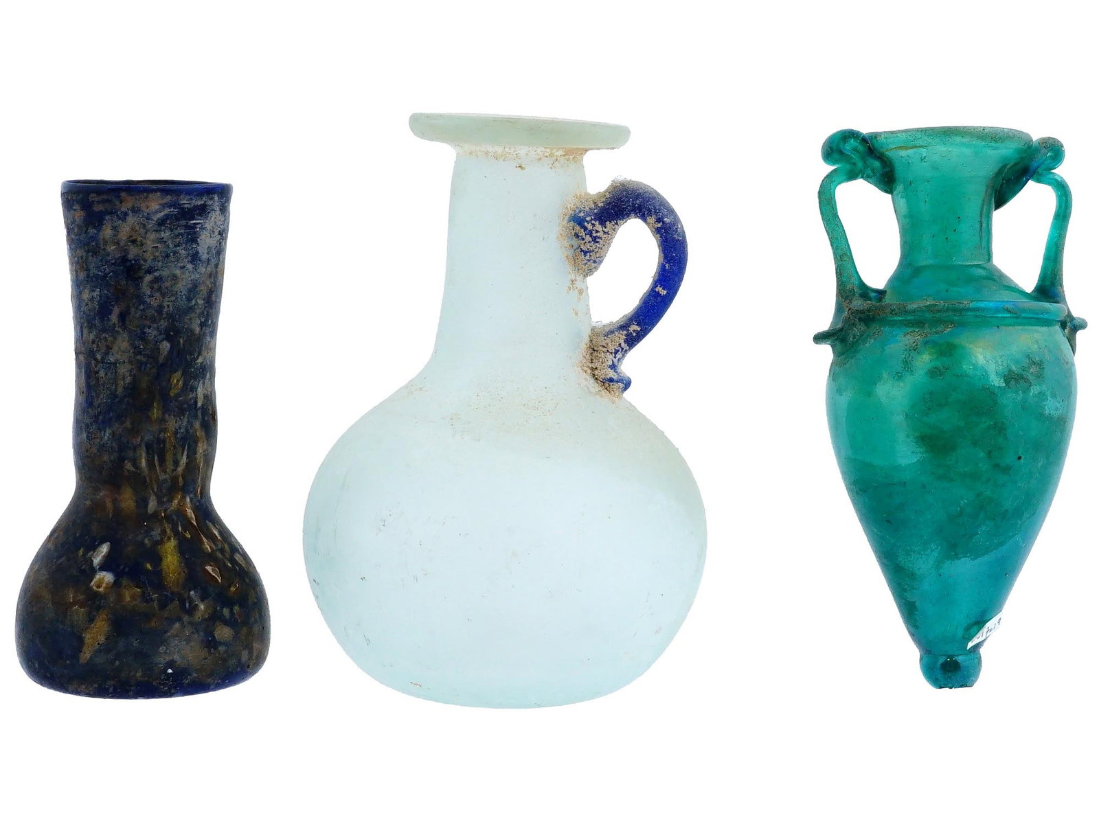 THREE ROMAN MANNER GRAND TOUR GLASS VESSELS: A group of three Roman manner, Grand Tour glass vessels. The first vessel is a tall, slender bottle made of dark blue glass, with a textured surface and a wide base. The second vessel is a round bodie