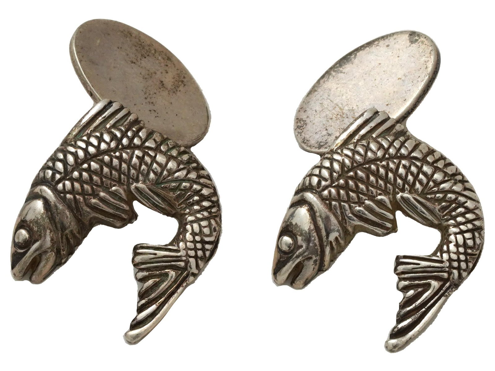 ATTR TO WEBSTER STERLING SILVER FISH FORM CUFFLINKS: A pair of Sterling Silver figural cufflinks, attributed to Stephen Webster. the cufflinks are made in the shape of fish, engraved with detailed patterns. Marked with a Sterling Silver standard hallmar