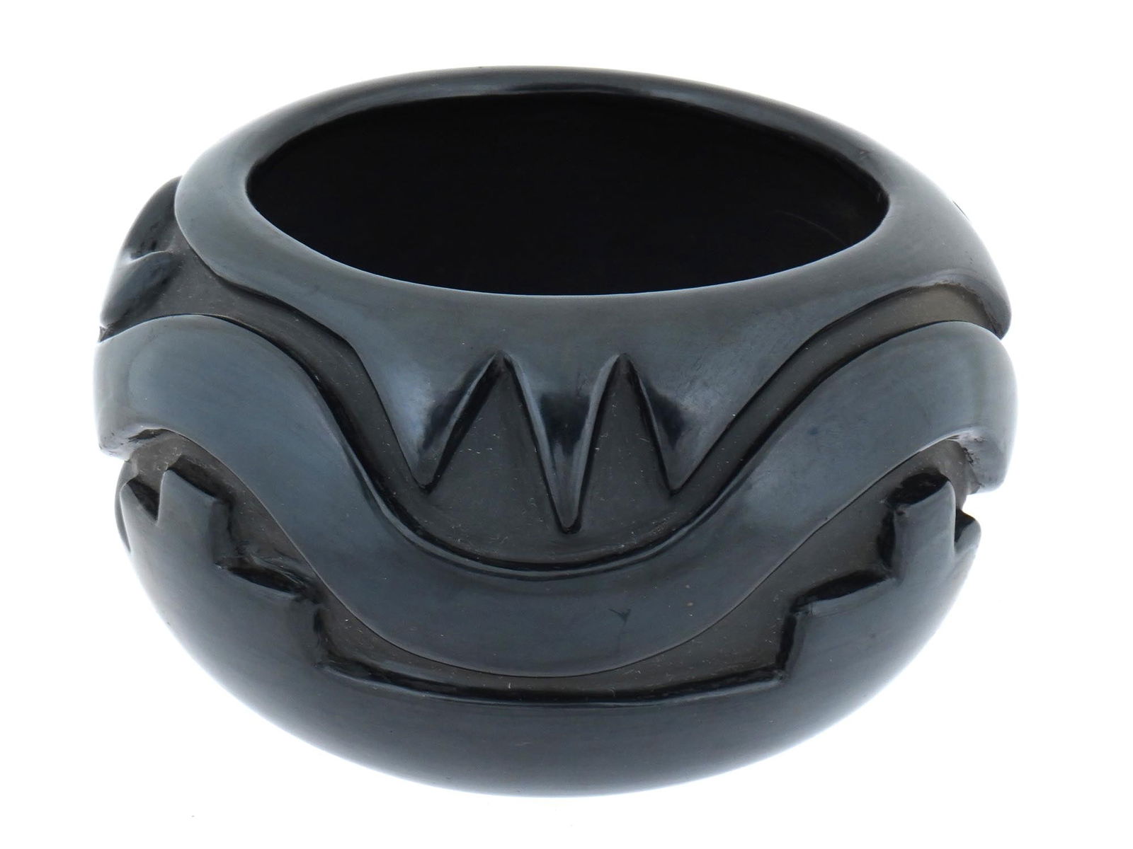 NATIVE AMERICAN POTTERY BOWL WITH RELIEF DRAGON: A Native American pottery bowl. This round piece, masterfully crafted featuring relief stylized dragon around the body. Bears an inscription on the bottom. Vintage and Antique Native American Pottery