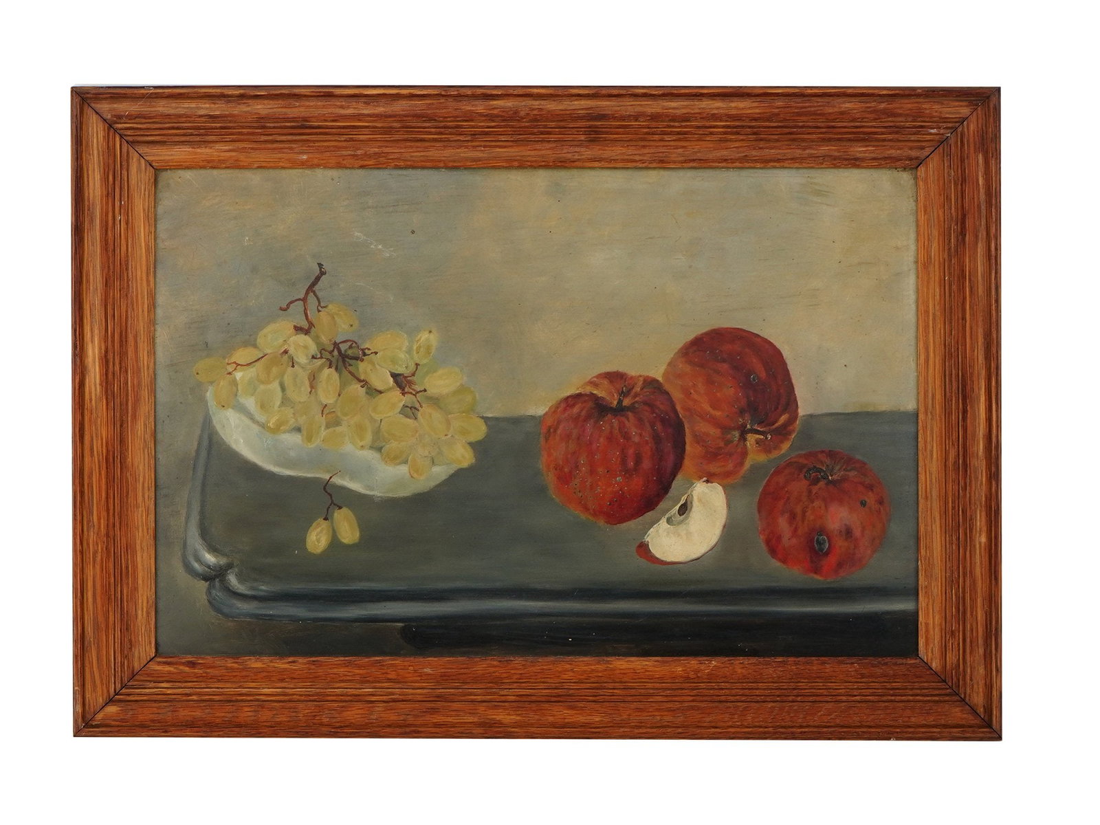 ICELANDIC FRUIT STILL LIFE OIL PAINTING BY SWAN HILDUR: Oil on canvas painting by Swan Hildur, a contemporary Icelandic sculptor based in England. The artwork depicts a still life with apples and grapes. Signed by the artist on the backside. Wooden frame. 
