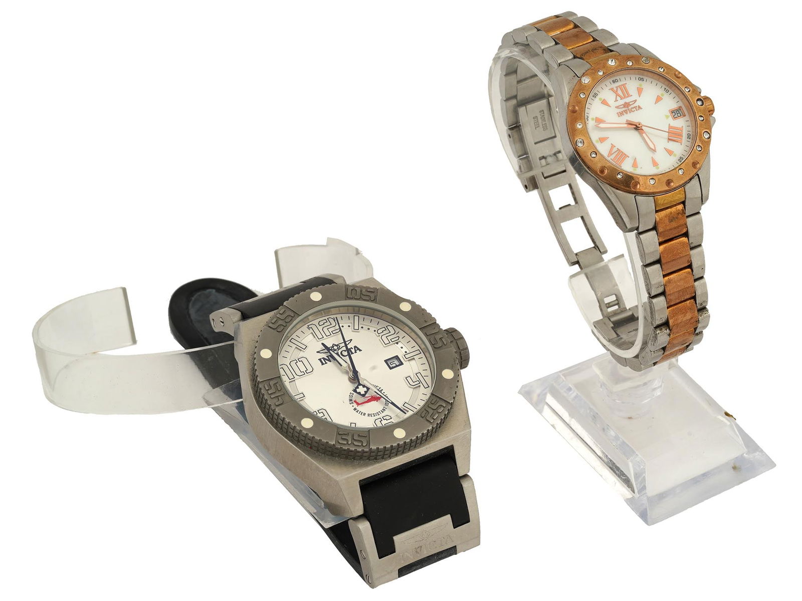 LOT OF SWISS INVICTA WATER RESISTANT WRIST WATCHES: A lot of two Invicta wrist watches. Swiss made. The lot includes an Invicta Water Resistant 100 m model No. 0323 with a white enamelled dial and Arabic numerals; and an Invicta Angel Collection Divine
