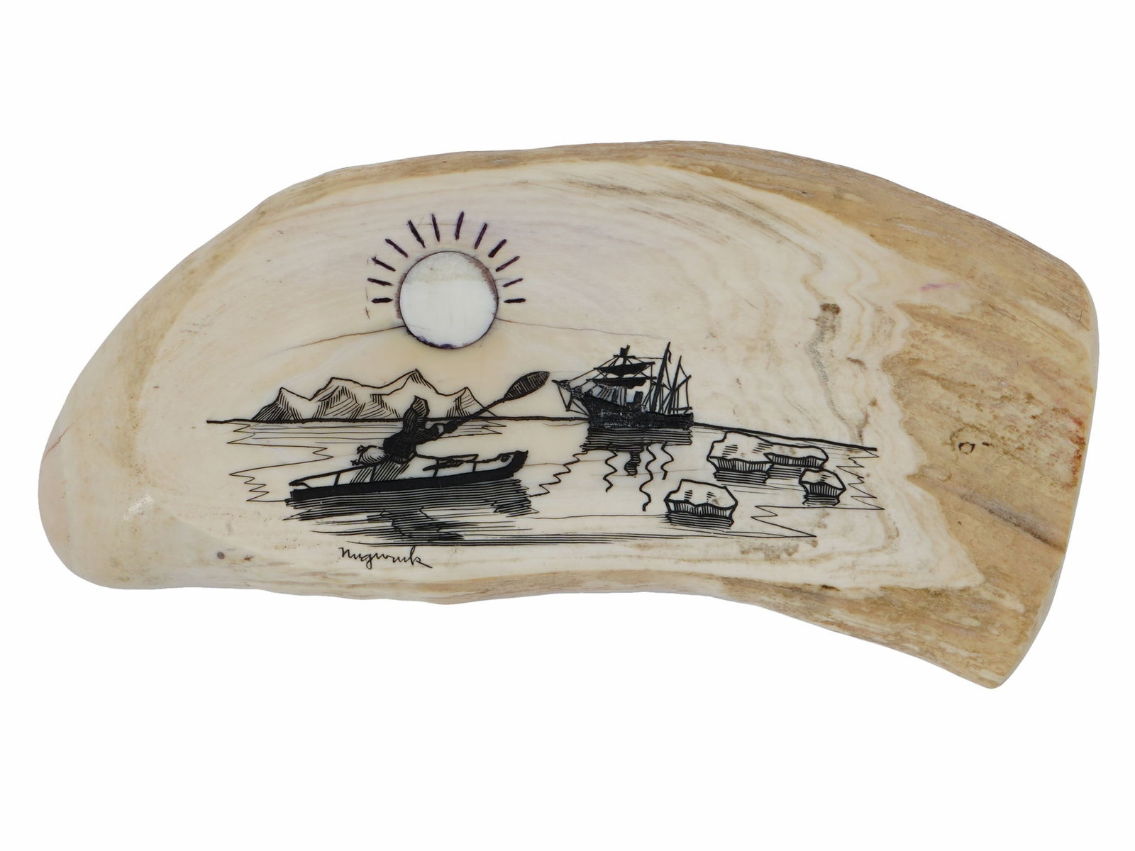 MID CENTURY AMERICAN NAVAL SCRIMSHAW ENGRAVING: An American scrimshaw whale tooth artwork featuring intricate engravings. Circa mid to late 20th century. Hand etched depiction of a kayak with a rower and a fishing boat in the distance. Signed by ar