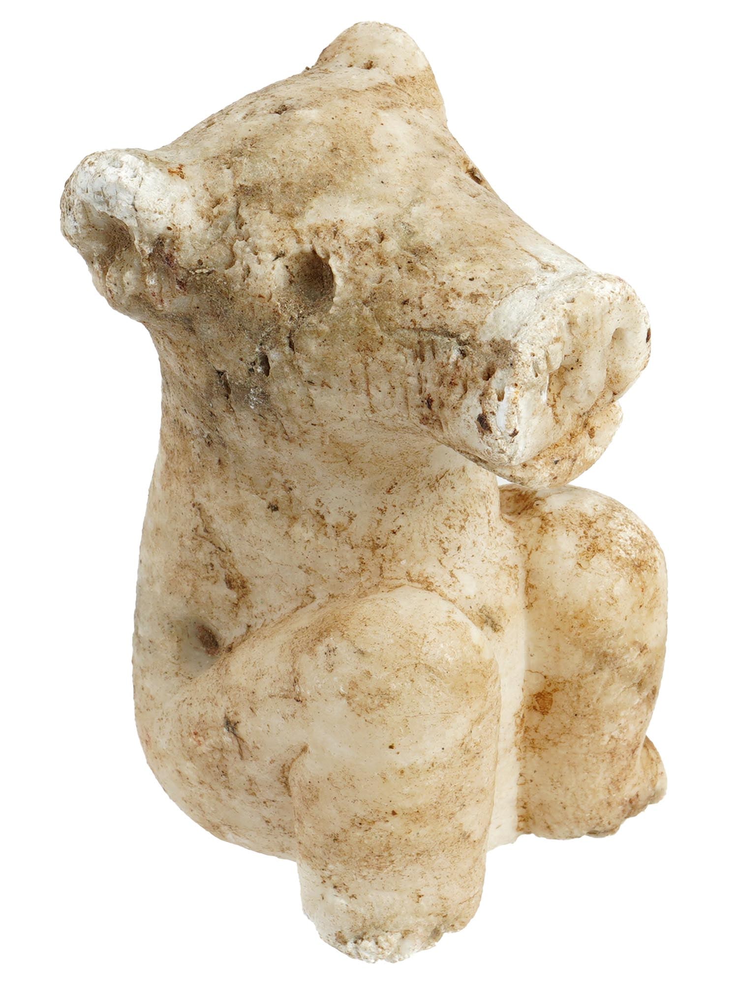 ANCIENT CARVED MARBLE PIG FIGURINE CA 600 TO 300BC: An ancient carved marble seated pig figurine. Circa 600 to 300 BC. The well detailed figurine depicts a pig sitting in a human like position with bent knees and a large head. Archeological Finds And R