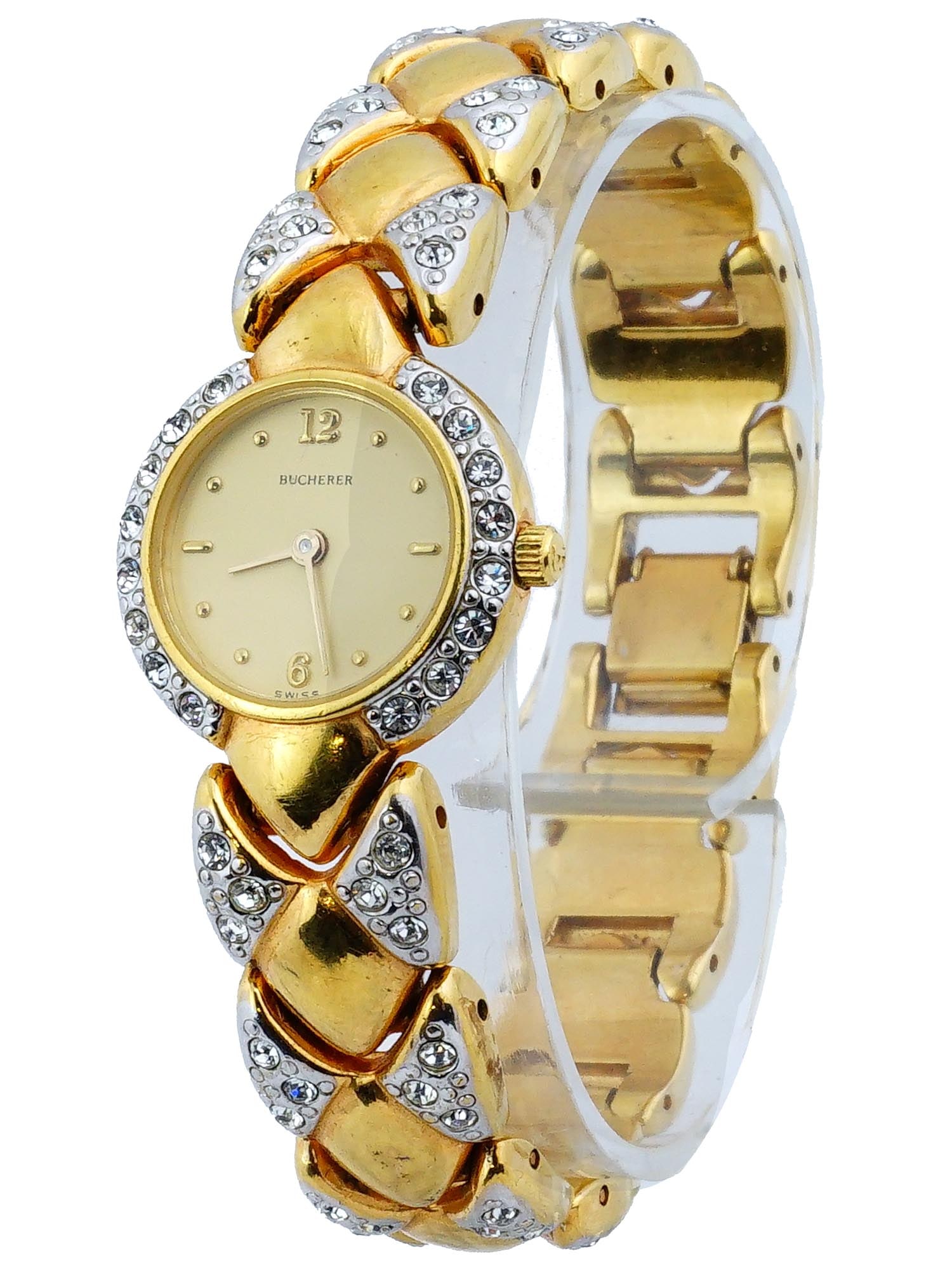 SWISS BUCHERER GOLD FILLED LADIES WRISTWATCH: A vintage ladies water resistant wristwatch by Carl F. Bucherer, a Swiss brand established in 1888. The wristwatch is gold filled, set with rhinestones. A round case with a single crown. The dial with