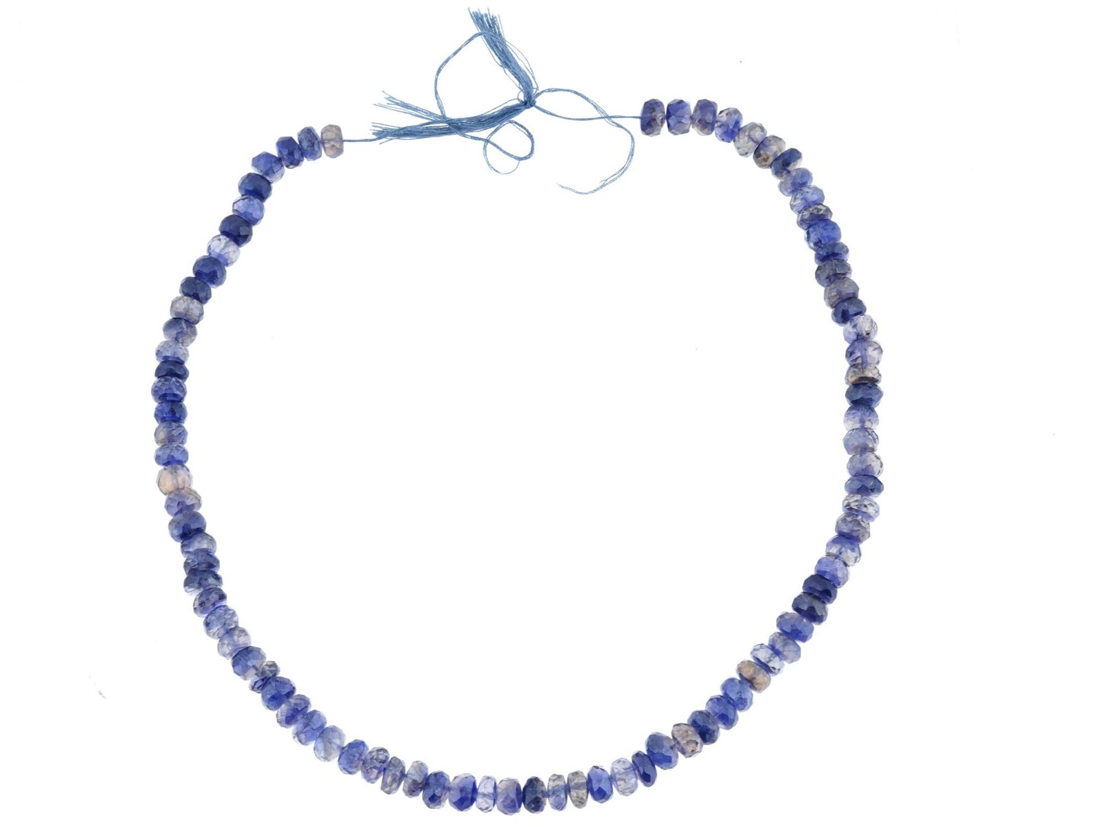 SET OF CUT SAPPHIRE STONE BEADS FOR A NECKLACE: A set of cut sapphire stone beads, strung on a cord and ready to be crafted into a necklace. The beads showcase the rich, deep blue hues characteristic of natural sapphires, each cut to enhance their 