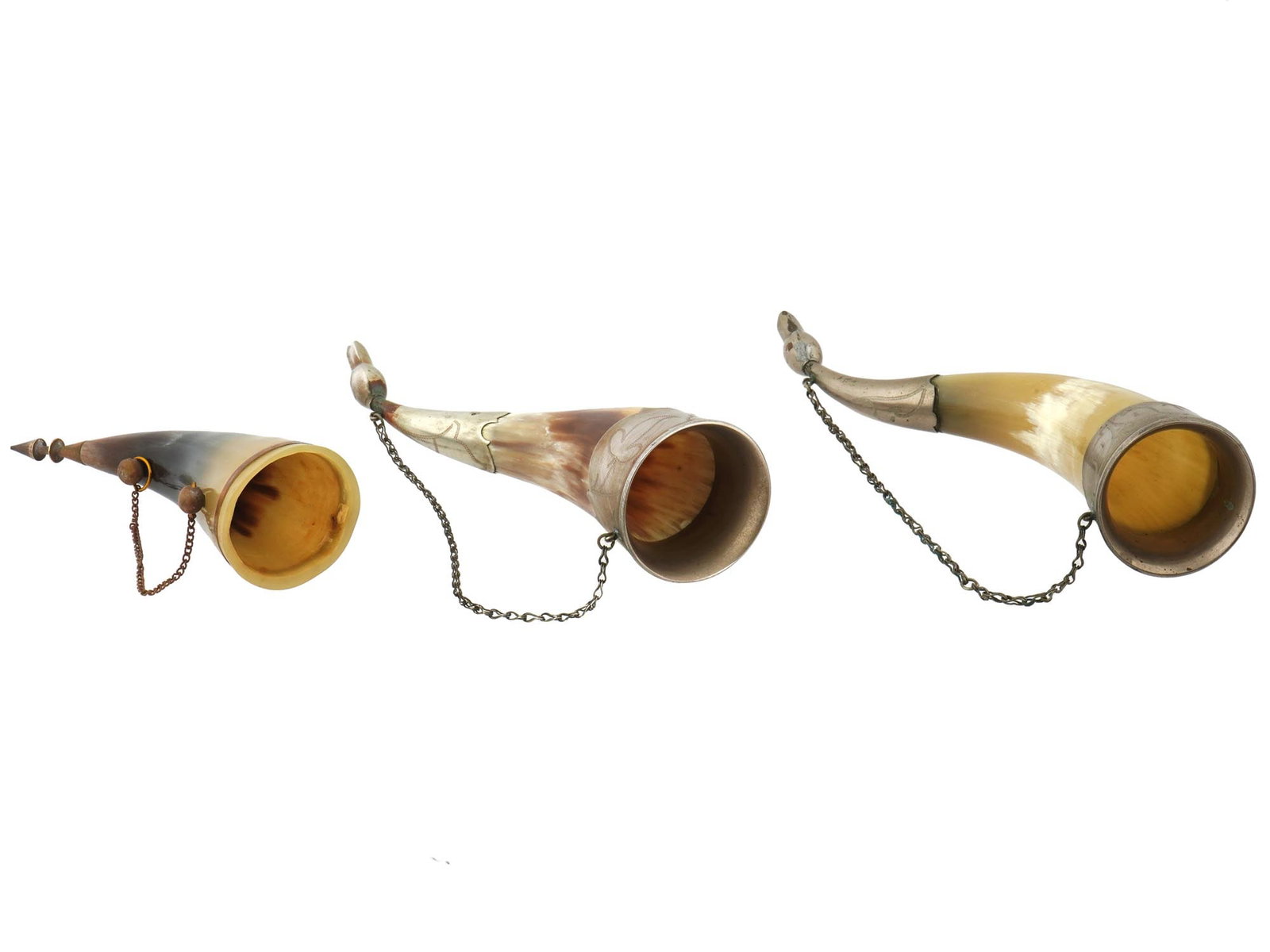 SOVIET ERA CAUCASIAN MOUNTED DRINKING HORN CUPS: A lot of Soviet era horn cups for wine drinking. Caucasian type. Second half of the 20th century. A total of 3 items of various size. Made of natural materials, chased brass mounts and holding chains.