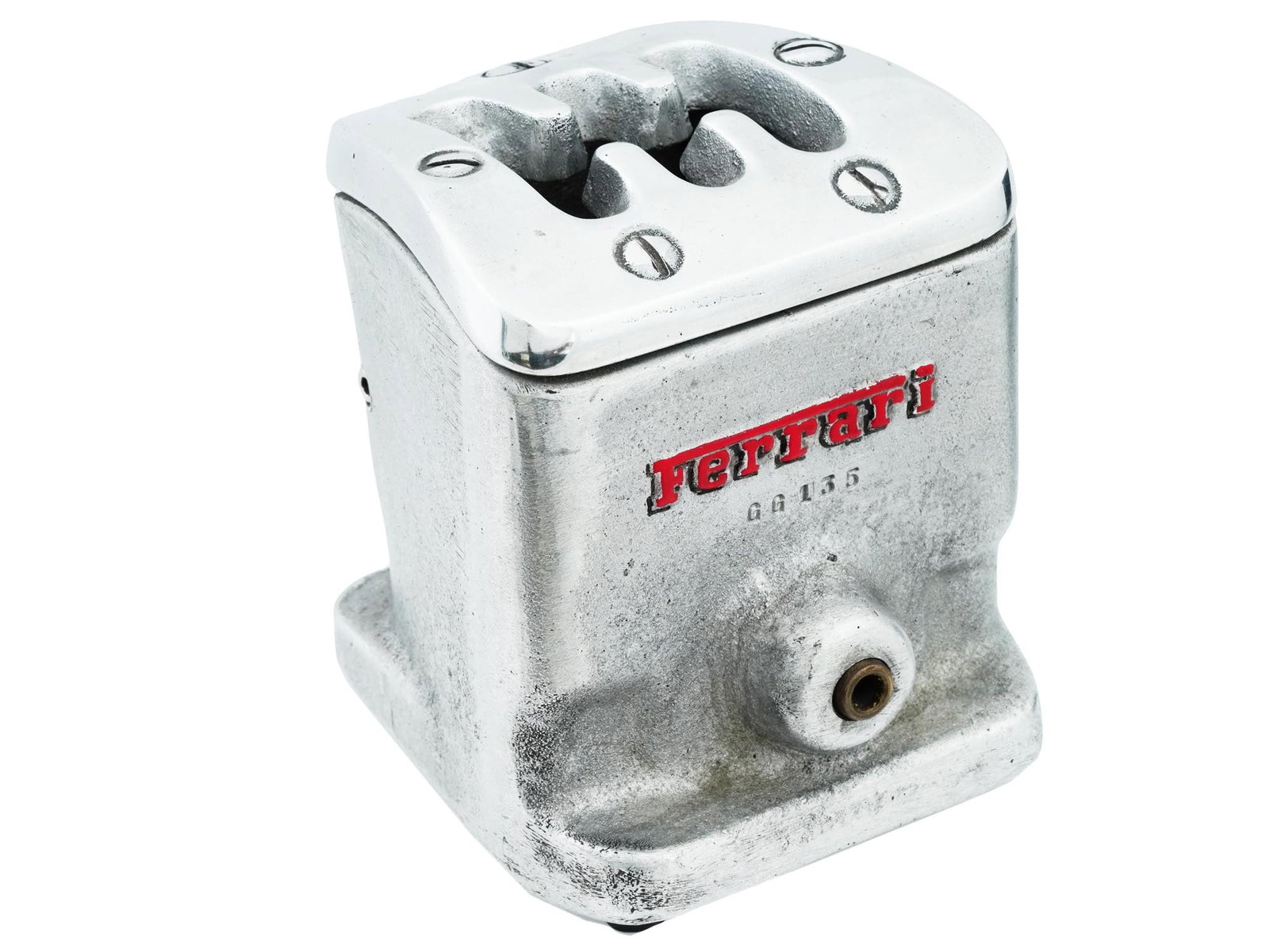 MACCHINA ROSSA FERRARI SHIFT GATE DESIGN ASHTRAY: A vintage Macchina Rossa Ferrari metal ashtray. The ware is made in a shift lever shift date design. Marked with a red enamel Ferrari mark, and numbered GG 135, on the front. Marked, Macchina Rossa, o
