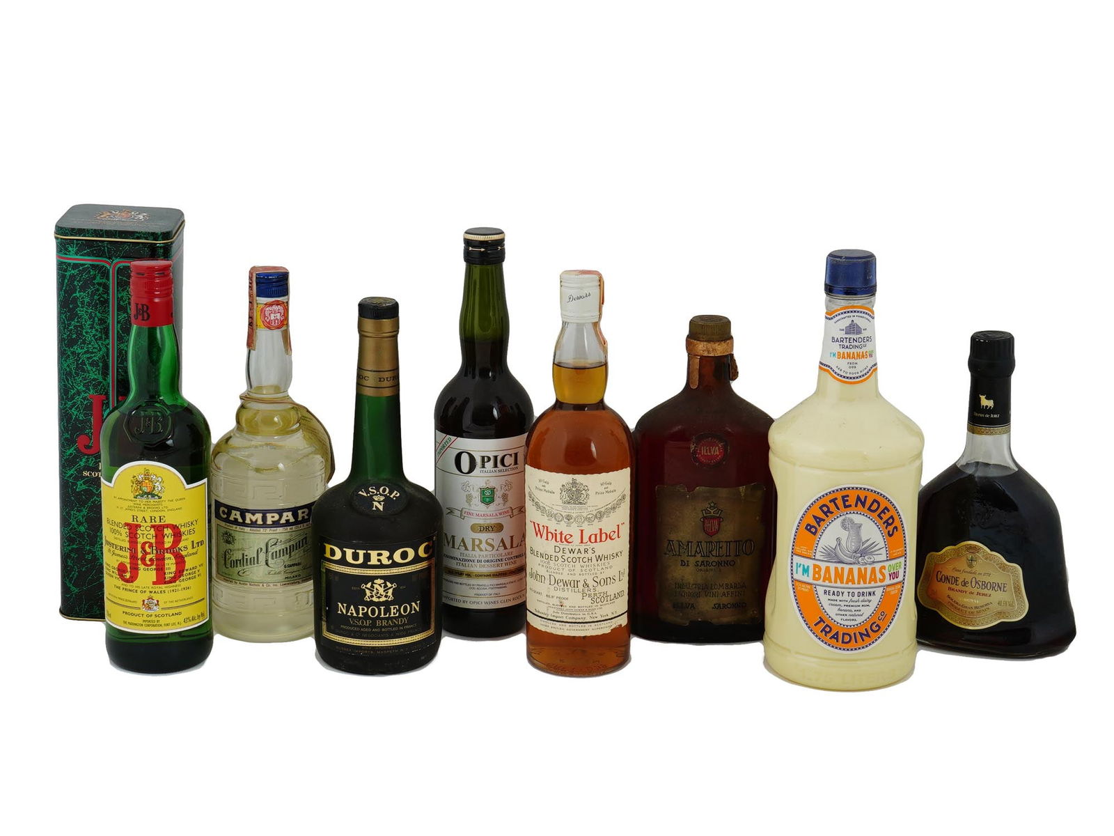 CAMPARI DEWARS AMARETTO LIQUOR BOTTLES IOB: A lot of vintage sealed alcohol bottles. A total of 9 items. J and B Rare Blended Scotch Whiskey, in original box. Campari Cordial. Duroc Napoleon VSOP Brandy. Dewars White Label Blended Scotch Whiske