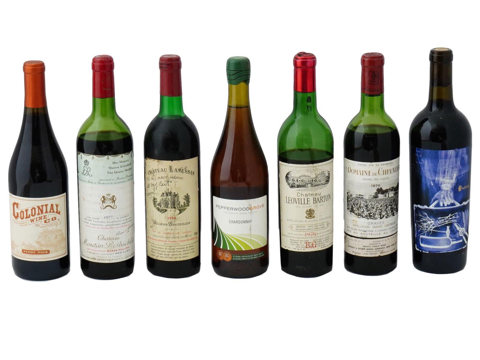 CHATEAU MOUTON ROTHSCHILD LANESSAN WINE BOTTLES: A lot of vintage sealed wine bottles. A total of 7 items. Colonial Wine Co., Pinot Noir, 2015. Chateau Mouton Rothschild, 1977. Chateau Lanessan, Haut Medoc, Delbos Bouteiller, 1982. Pepperwood Grove