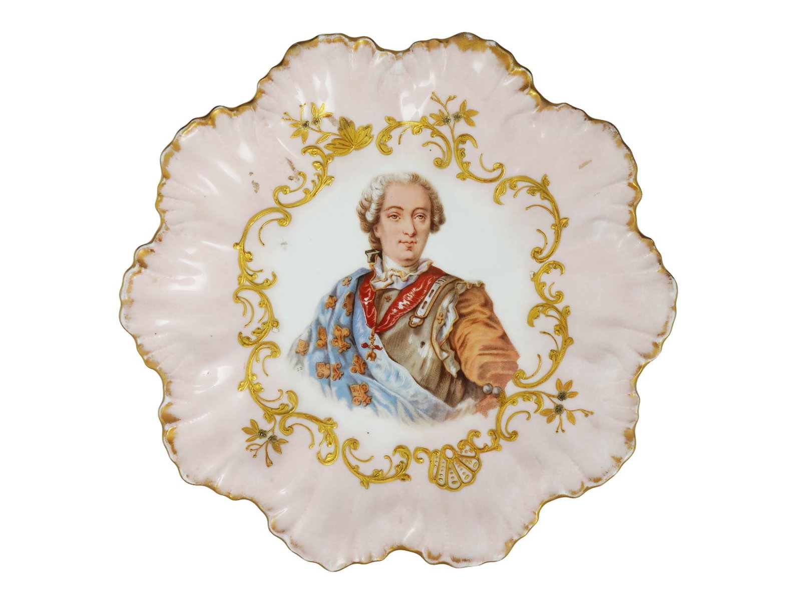 ANTIQUE FRENCH LIMOGES KING LOUIS XVI PLATE 19TH C: An antique French decorative Limoges plate with a portrait of King Louis XVI. Circa 19th century. The plate is pink with an openwork gilded edge. In the middle is a portrait image of the French King L