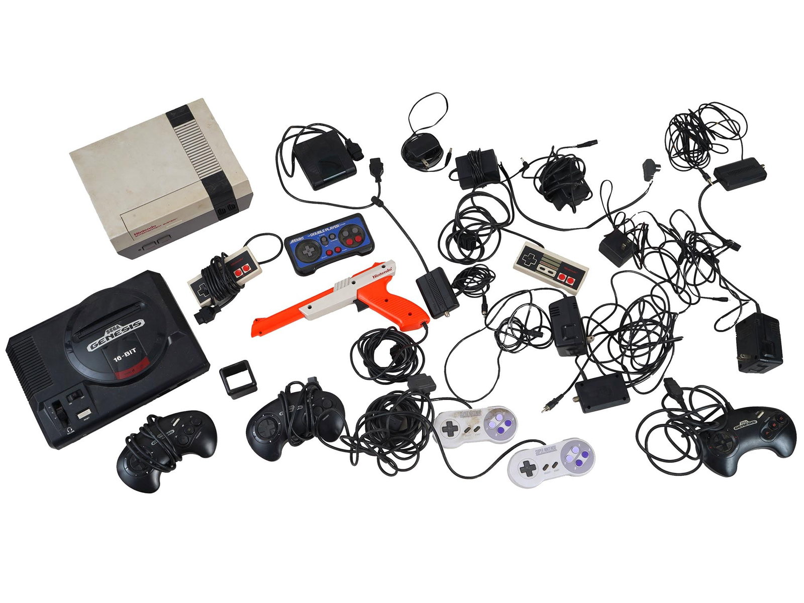 VARIOUS VINTAGE GAME CONSOLES AND ACCESSORIES NINTENDO: A collection of various vintage game consoles and accessories, including Nintendo, a Nintendo gun, Super Nintendo controllers, Sega Genesis, and Aklaim components, accompanied by an assortment of wire