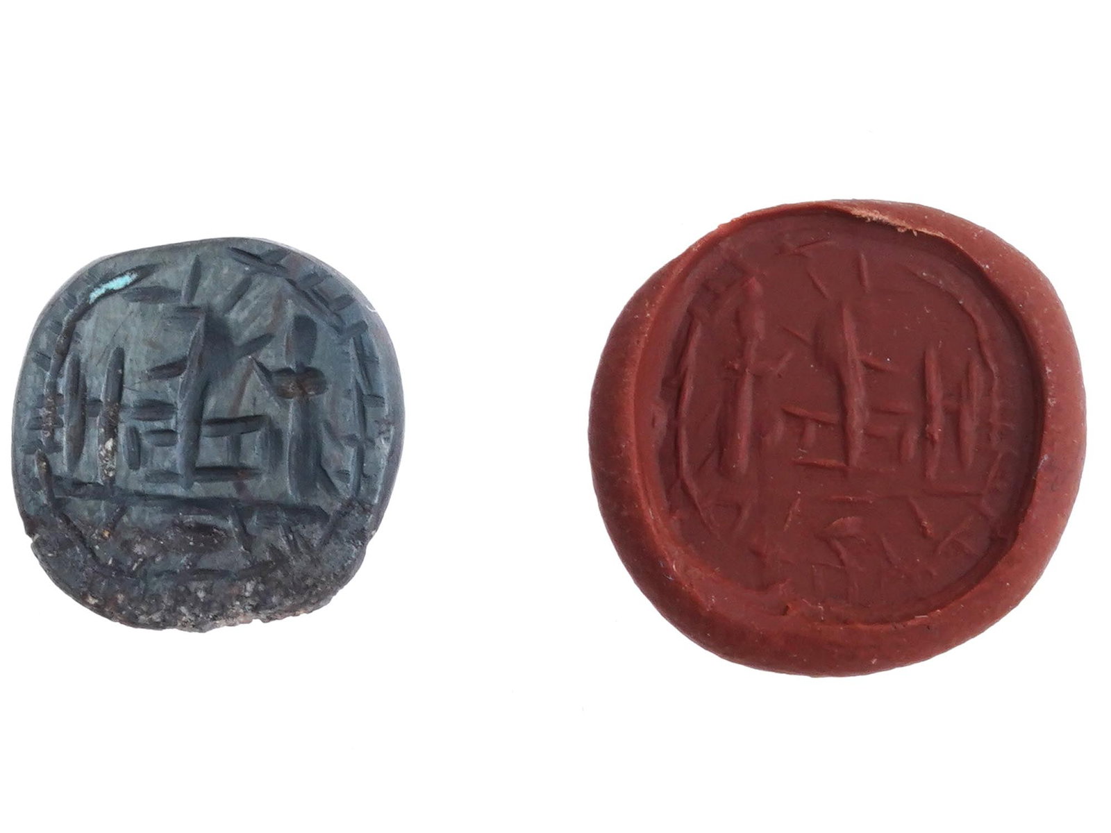 ANCIENT EGYPTIAN ENGRAVED HEMATITE INTAGLIO SEAL: An ancient Egyptian Late period oval shaped hand carved intaglio seal, made of Hematite stone. The imprint depicts a magical scene. The reverse side of the item is smooth and flat. Circa: 700 to 200 B