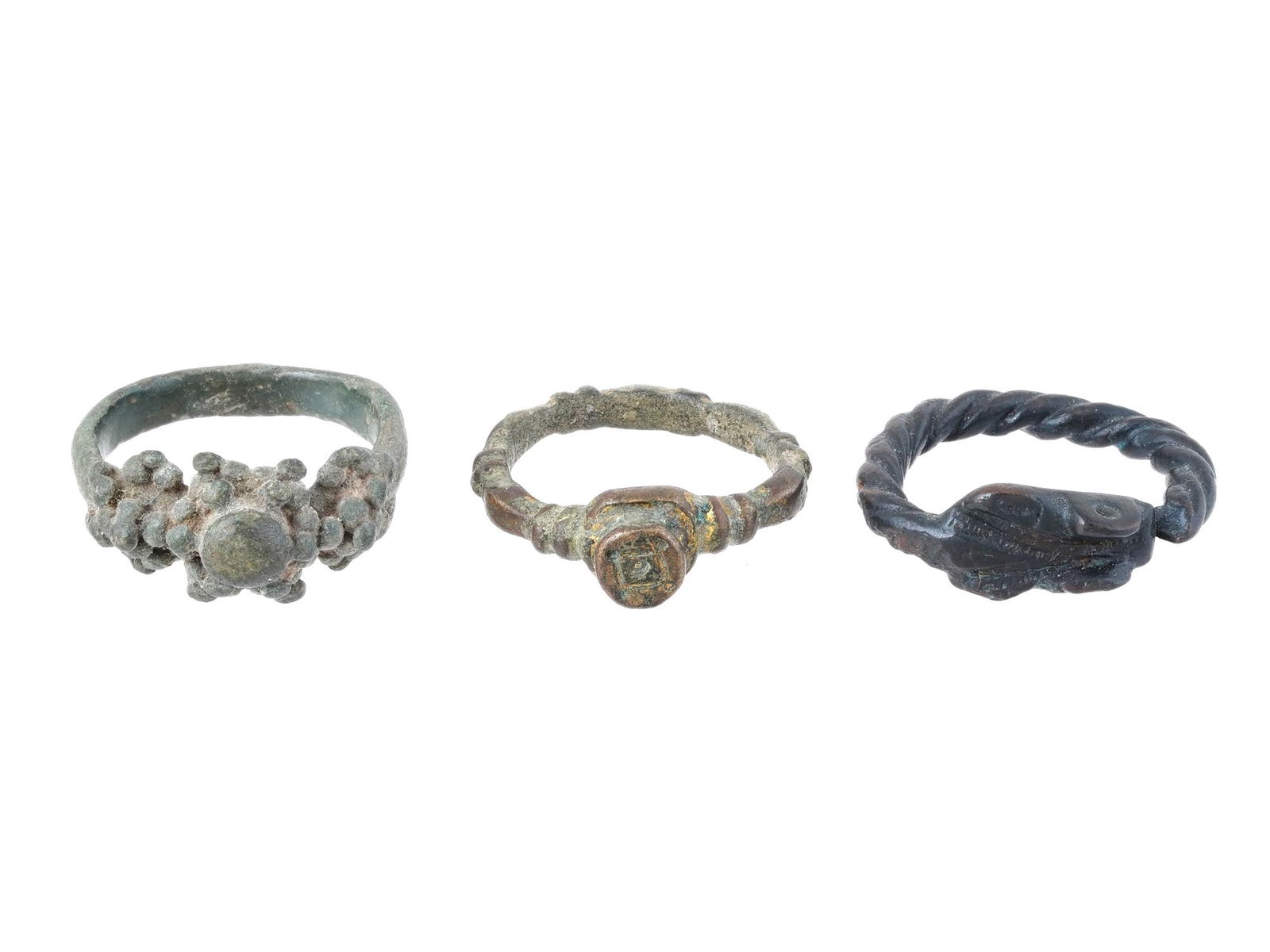 THREE ANCIENT ROMAN BRONZE RINGS WITH VARIOUS DESIGNS (1 of 4)