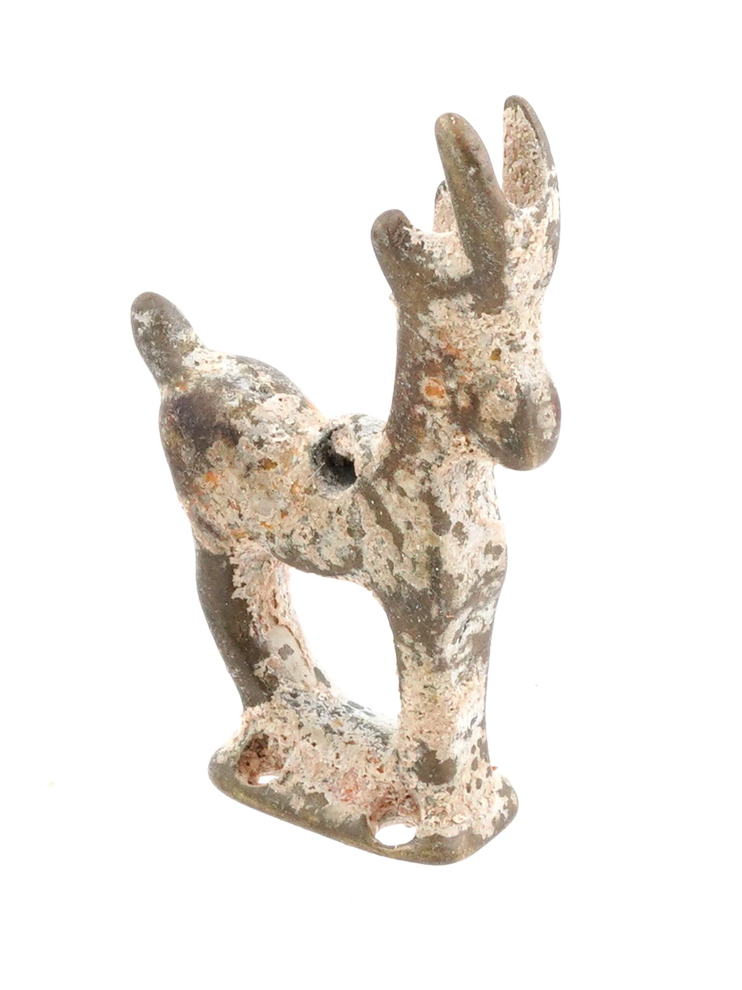 ANCIENT LURISTAN IRANIAN ART BRONZE DEER FIGURINE: An ancient Luristan bronze figurine of a deer dating back to circa 600 to 300 BC and showcasing the craftsmanship of early Iranian art. The deer is elegantly rendered, capturing its graceful form and