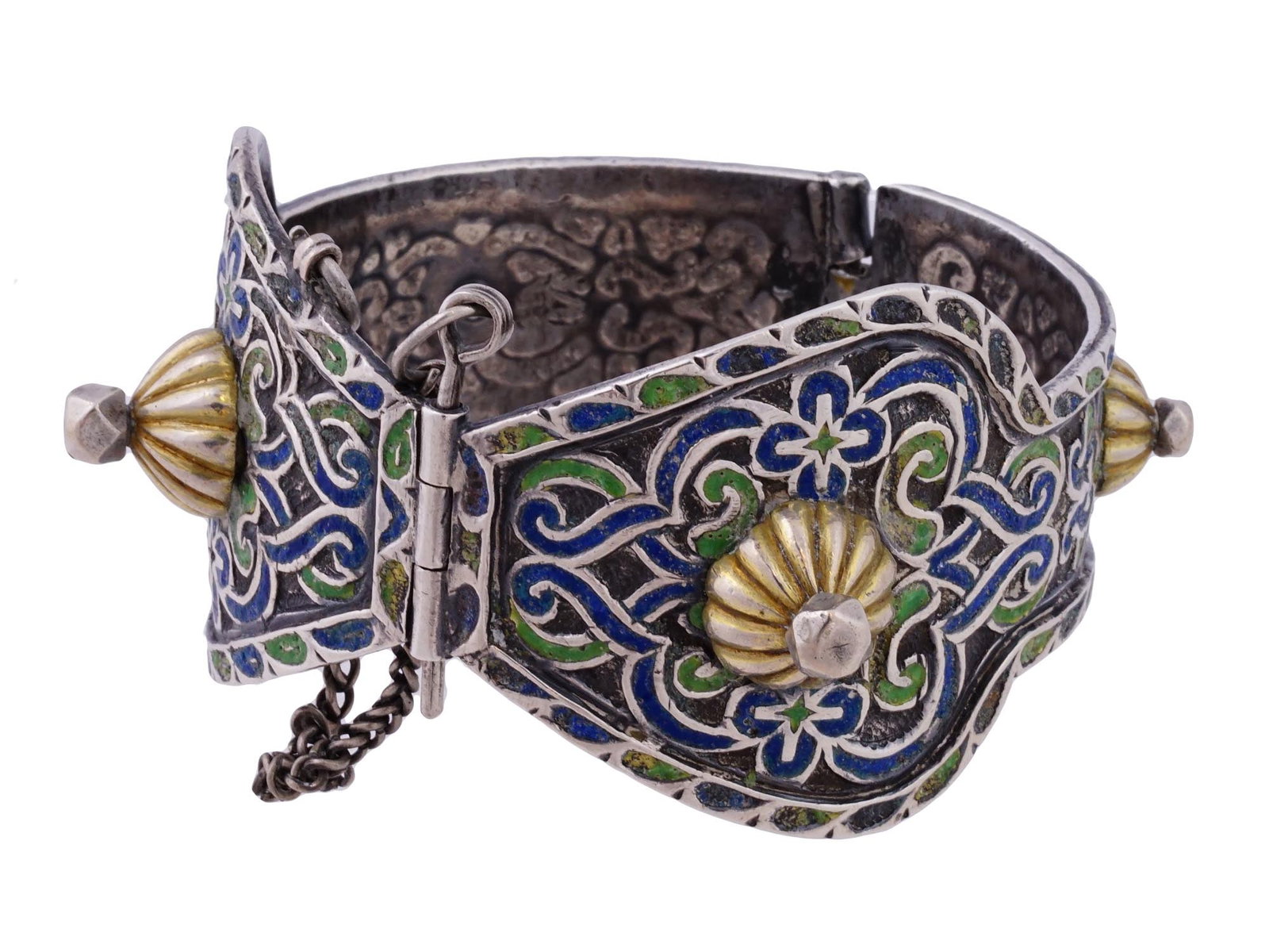 ANTIQUE BERBER PROBABLY SILVER AND ENAMEL BRACELET: An antique circa early 20th century Berber bracelet from the Zaiane tribes of Morocco. Presumably made of silver and adorned with a beautiful floral pattern covered with polychrome enamel all over the