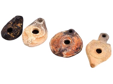 FOUR ANCIENT TERRACOTTA OIL LAMPS WITH RELIEF DESIGN
