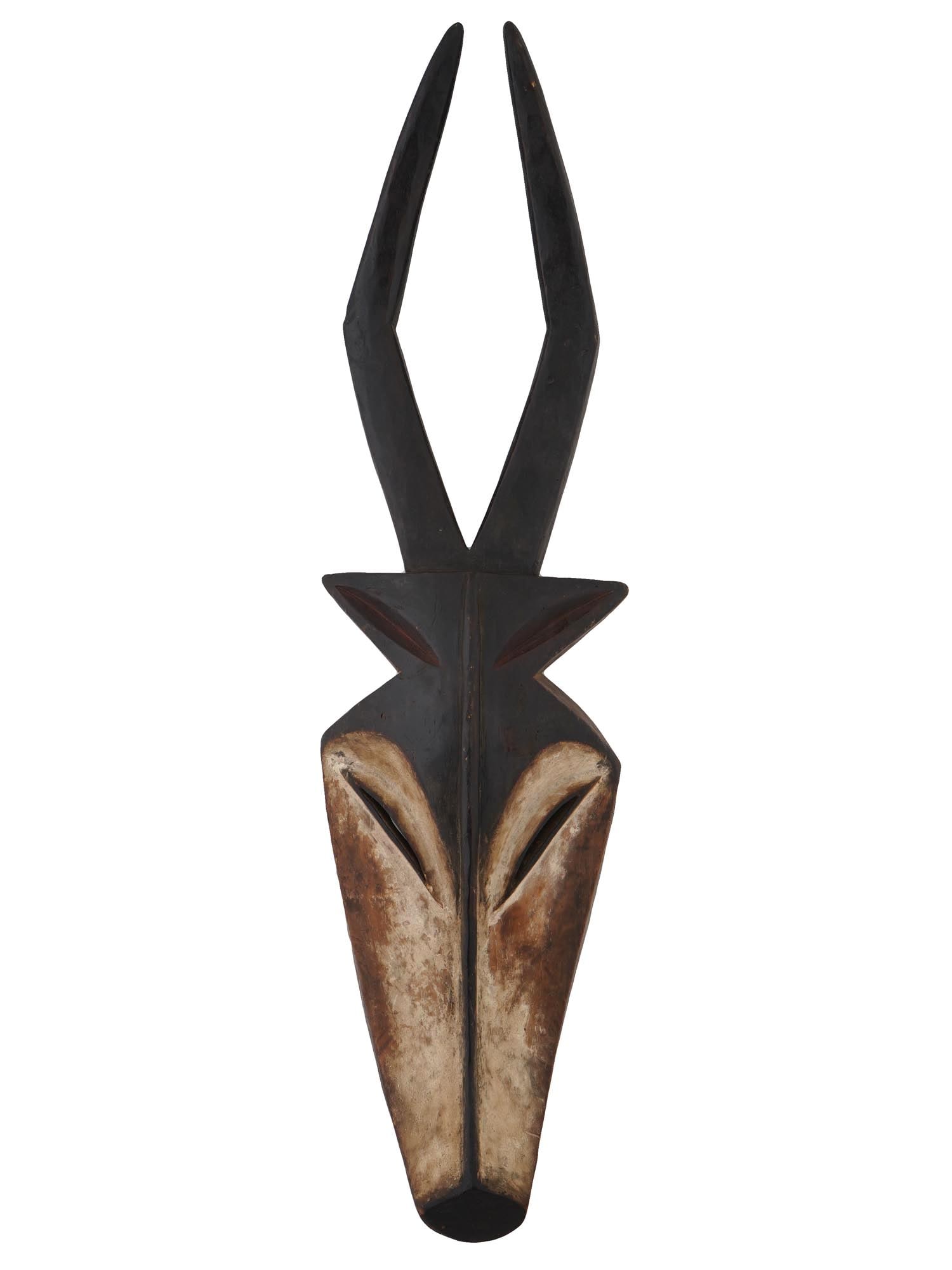 CENTRAL AFRICA GABON KWELE WOODEN ANTELOPE MASK: A fine Central Africa Gabon hand carved wooden and colored Kwele antelope mask. Used in fertility rituals. These masks depict an antelope, whose meat is eaten at the end of the Bat ritual. It is belie