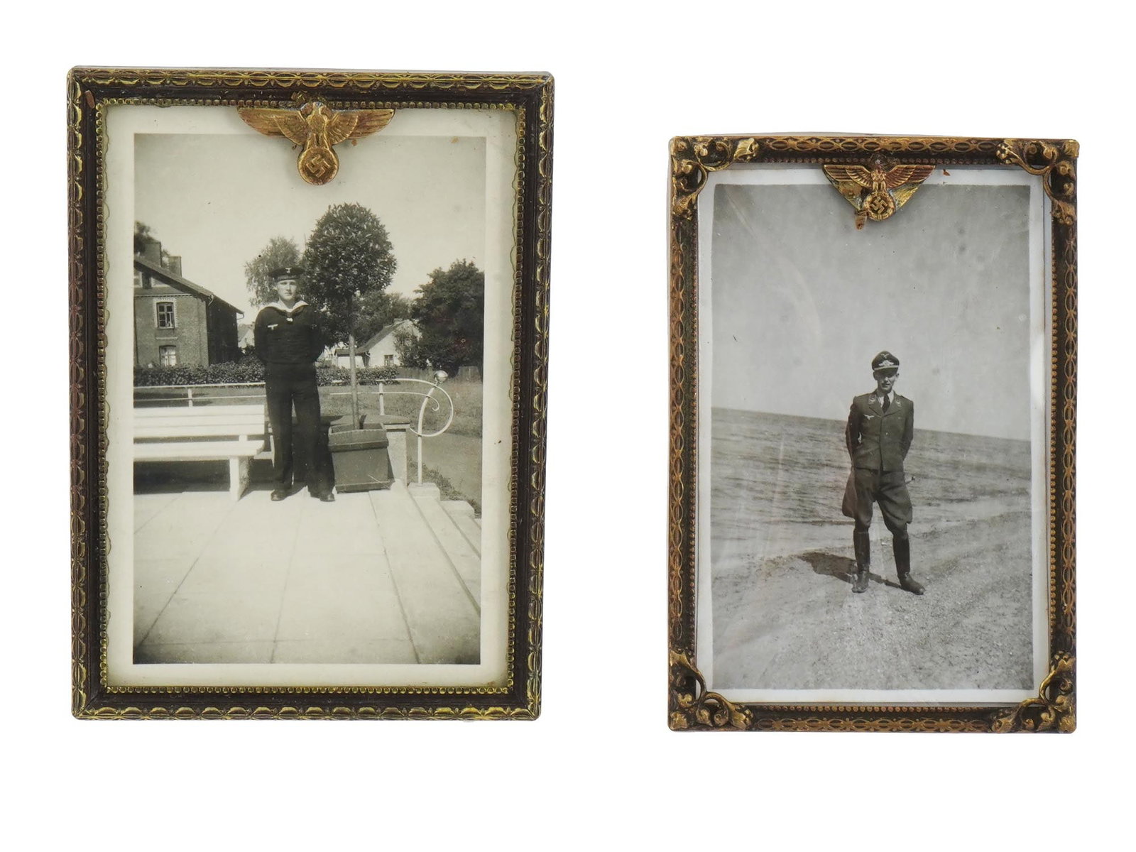 PAIR OF GERMAN WWII PICTURE FRAMES WITH MILITARY PHOTOS: A pair of World War II Nazi German gilt brass standing picture frames with Reichsadler decor. Original label stickers are preserved on the backside. The frames are set with black-and-white full length