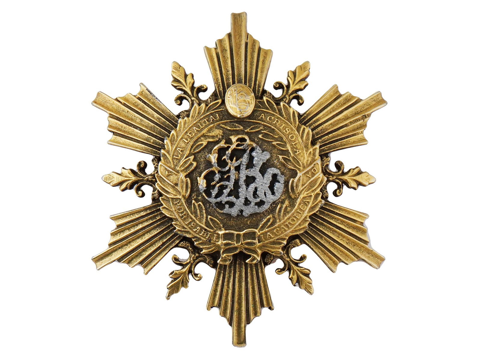 AMERICAN ORDER OF ISABELLA FERDINAND BROOCH BY CORO: A vintage American late 20th century gilt brooch created in the manner of the Order of Isabella Ferdinand by the largest manufacturer of costume jewelry, Coro. The brooch is a gilt star with a wreath