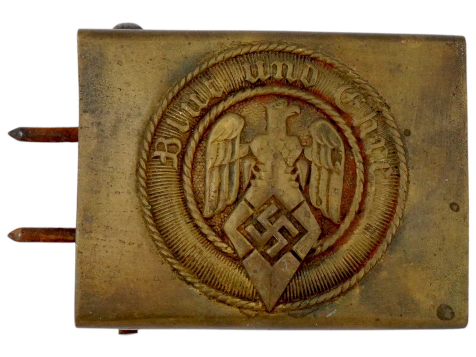 WWII GERMAN NAZI HITLER YOUTH BELT BUCKLE FOR EM: A WWII German Nazi Hitler Youth brass belt buckle for an enlisted man. The front is engraved with a motto in German, Blut und Ehre, translated to Blood and Honor, and the Hitler Youth eagle clutching 