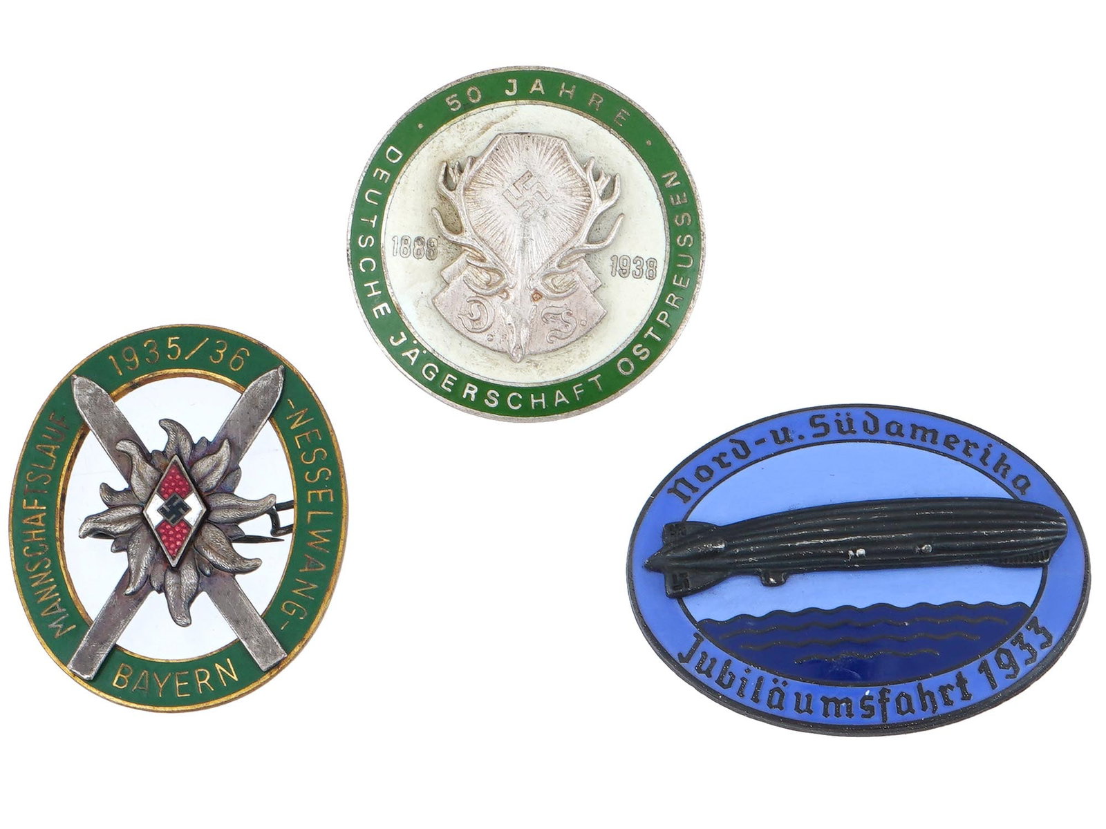 PRE WWII GERMAN THIRD REICH CIVIL BADGES: A lot of 3 pre WWII German Third Reich civil badges. The lot includes the Alpine Hitler Youth Bayern Ski badge with an inscription around the circle: Mannschaftslauf 1935 to 36 Nesselwang Bayern. 50th