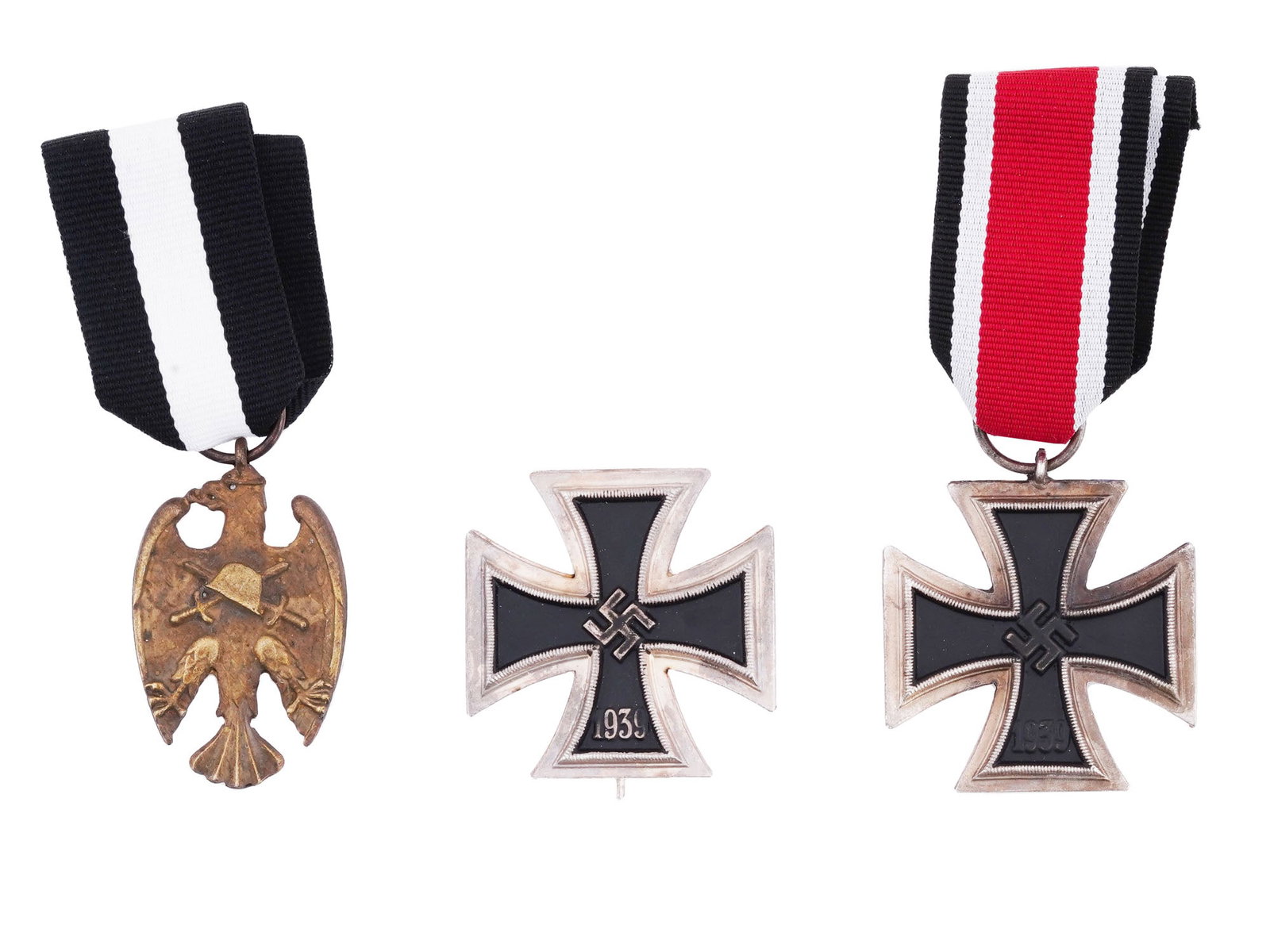 WWI AUSTRIAN HEIMWEHR MEDAL AND WWII NAZI IRON CROSSES: Three military awards from different periods in European history. The post WWI Austrian Republic Heimwehr Medal of Merit Starhemberg Vogel, complete with a ribbon, is a testament to the contributions 