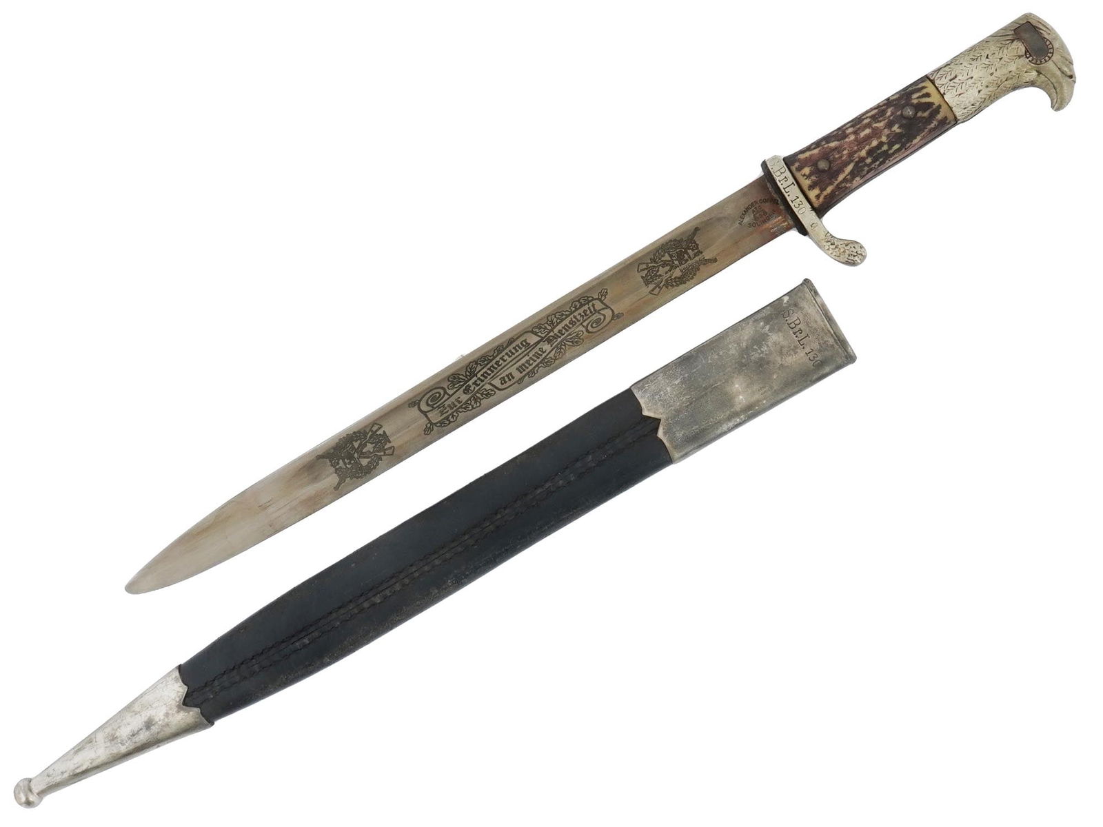 WWII GERMAN PRESENTATION BAYONET COPPEL SOLINGEN: A German Third Reich presentation bayonet. Stainless-steel blade with etched inscription Zur Erinnerung an meine Dienstzeit, To Commemorate My Time of Service, and Stahlhelm with rifles emblem. Handle