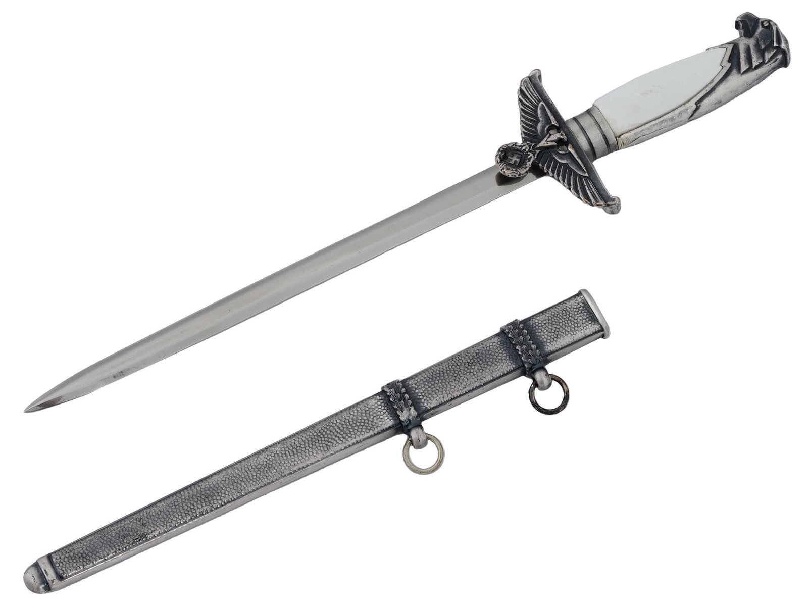 WWII GERMAN WWII DIPLOMATIC MINIATURE DAGGER: A rare WWII Nazi German miniature diplomatic dagger. Features the straight steel blade, the pommel is modeled in the form of the Reichsadlers head with a white decorative neck. The crossguard is in th