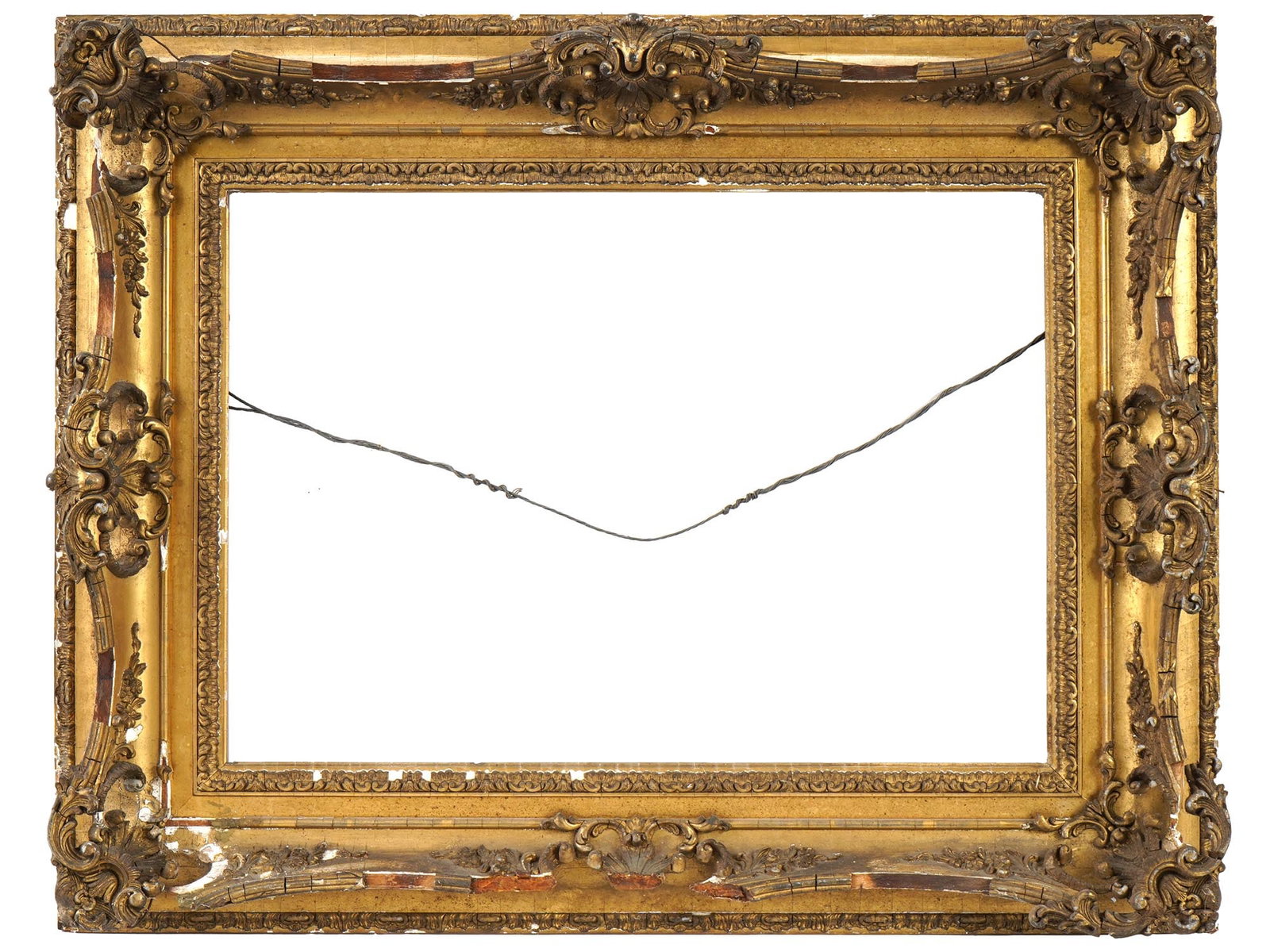 ANTIQUE SCULPTURED CARVED WOODEN GILT PAINTED FRAME: An antique sculptured carved wooden frame featuring a gilt-painted finish, enhancing its floral relief decor. Crafted in a rectangular horizontal shape. Dates to the 19th century. Antique Wooden Pictu