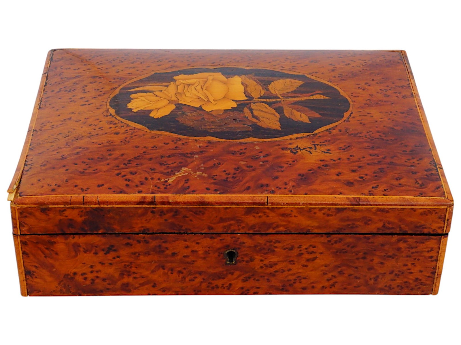 ANTIQUE ENGLISH MARQUETRY TRINKET OR JEWELRY BOX: An antique English marquetry trinket or jewelry box inlaid with pippy yew wood. Circa the late 19th century, 1880s to 1895. The rectangular, lacquered box with a hinged lid has one compartment inside.