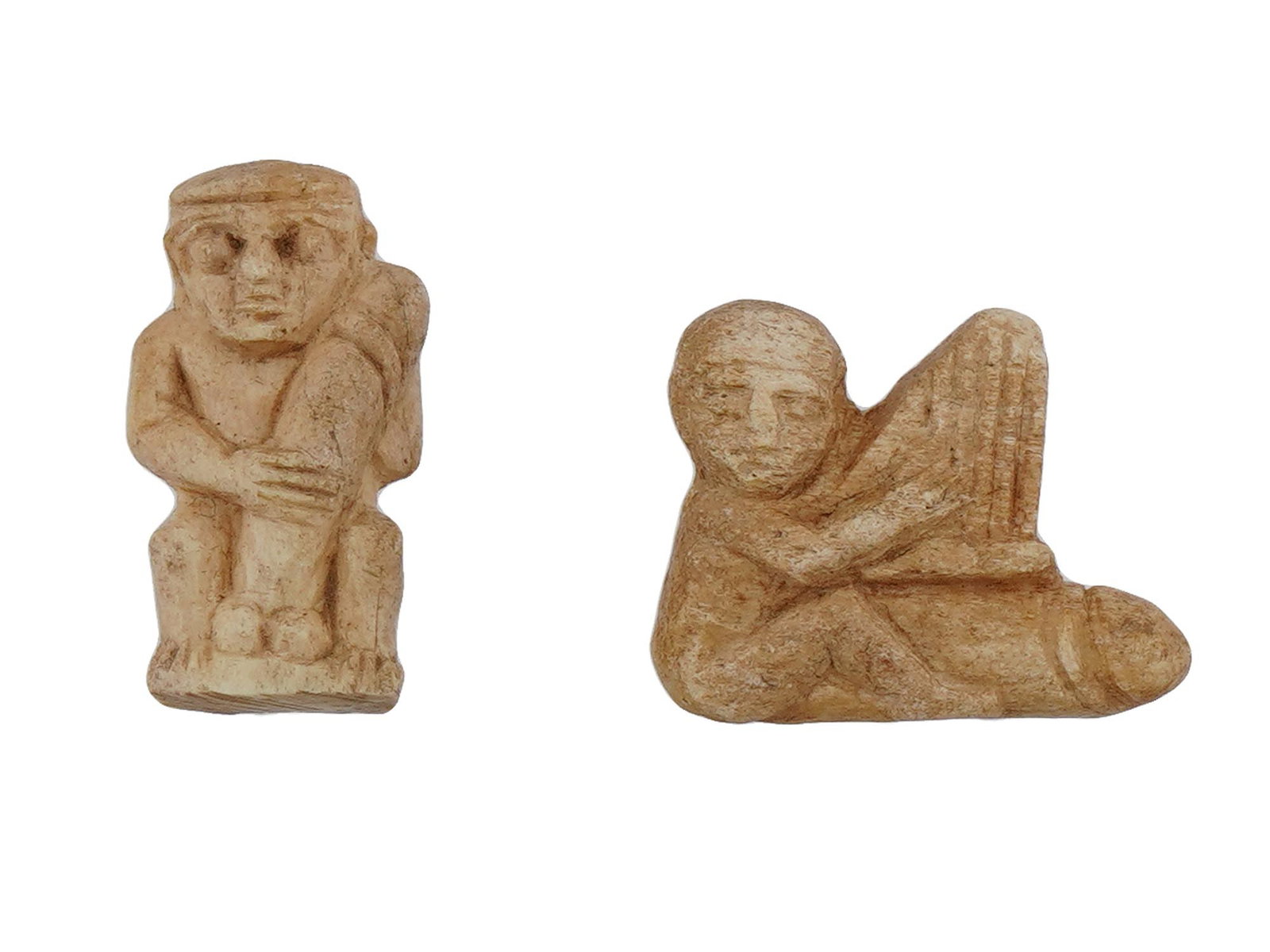 ANCIENT LATE PERIOD EGYPTIAN EROTIC AMULET PENDANTS: A lot of two ancient Egyptian erotic amulet pendants. Circa the Late Period 700 to 200 BC. The pendants have phallic symbolism associated with the cult of fertility. A through hole for threading a cha