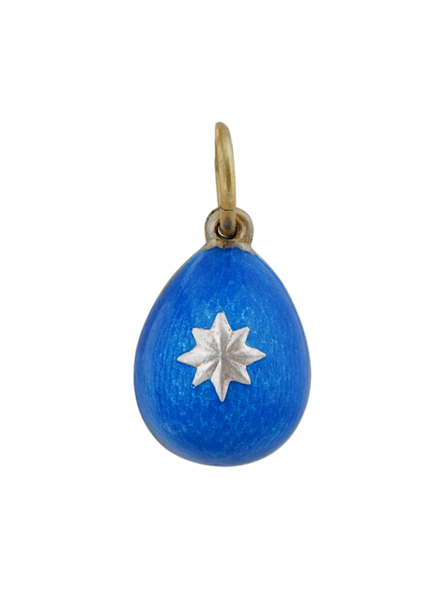 RUSSIAN GILT SILVER GUILLOCHE ENAMEL EGG PENDANT: A Russian gilt silver egg-shaped pendant. Blue guilloche enamel surface, star motif on the obverse. Hallmark of 88 silver standard and makers mark are on the fitting ring. Russian Silverware, Jewelry 