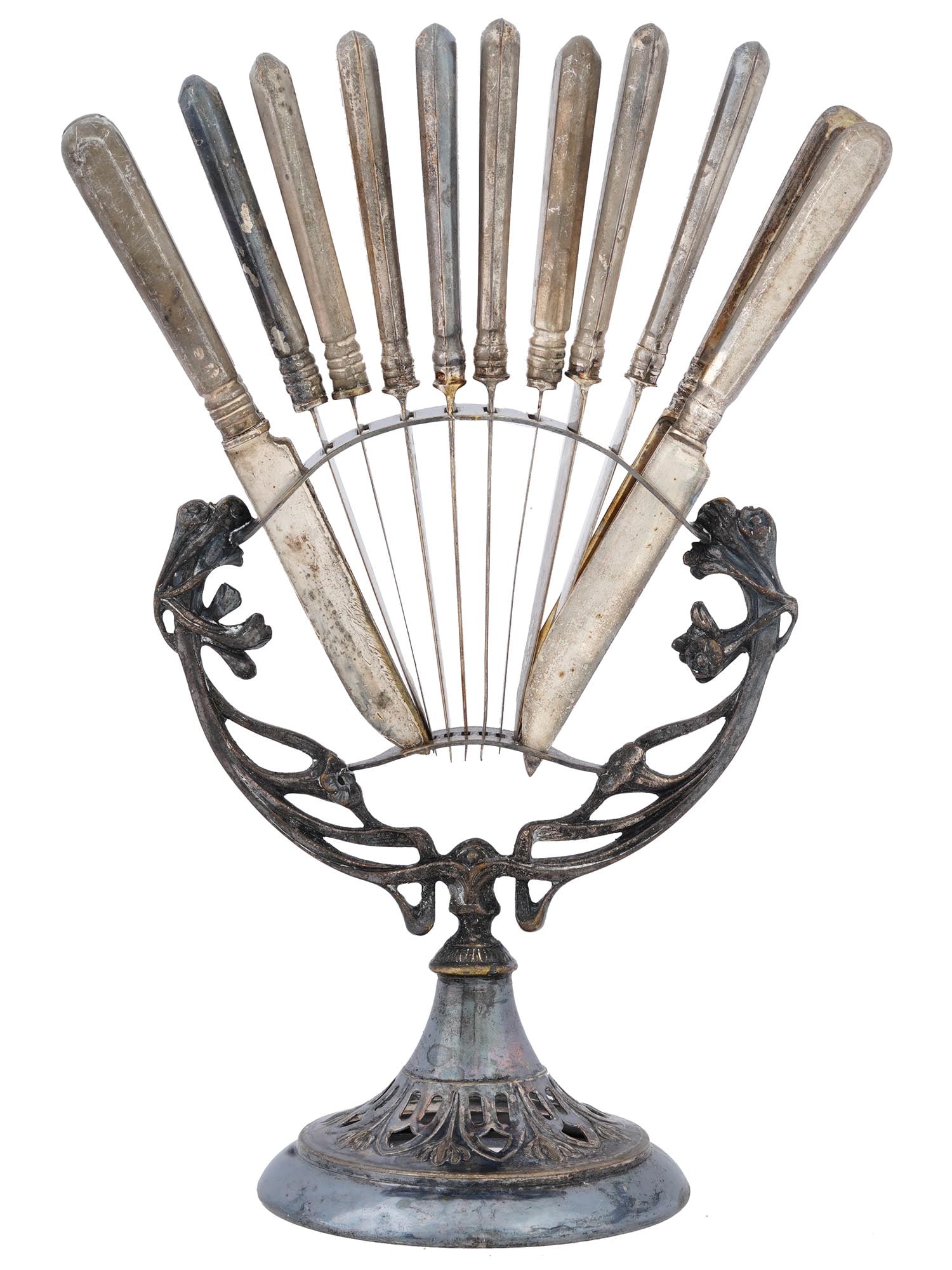 ART NOUVEAU PLEWKIEWICZ SILVER STAND AND KNIVES SET: A set of Russian silver fruit knives. A total of 12 items. One of the knives has a 84 silver standard hallmark with Saint Petersburg assay mark on the blade. The set comes with a unique Art Nouveau de