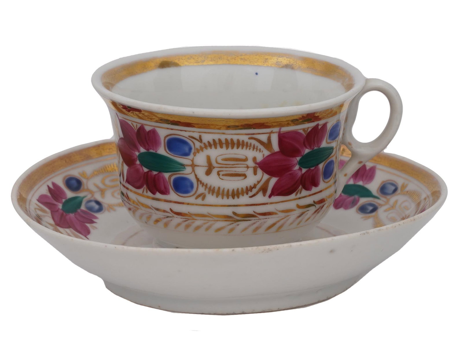 ANTIQUE RUSSIAN GULIN BROS TEA CUP AND SAUCER 1850: An antique Russian tea cup and saucer, produced by the Gulin Brothers Factory in Moscow around 1850, showcases a white porcelain base adorned with floral motifs in red and blue, accented with gilded t