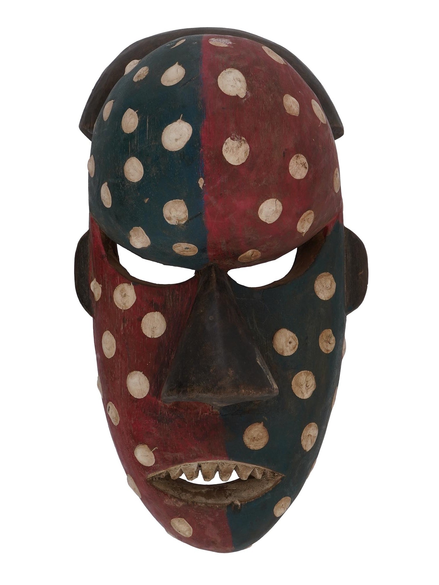 CENTRAL AFRICAN CONGO SALAMPASU CARVED WOODEN MASK: A Central African Congo Salampasu hand carved wooden mask. The elongated oval mask with a wide, protruding forehead, painted red and blue, and decorated with a pattern of large white dots. The mask ha
