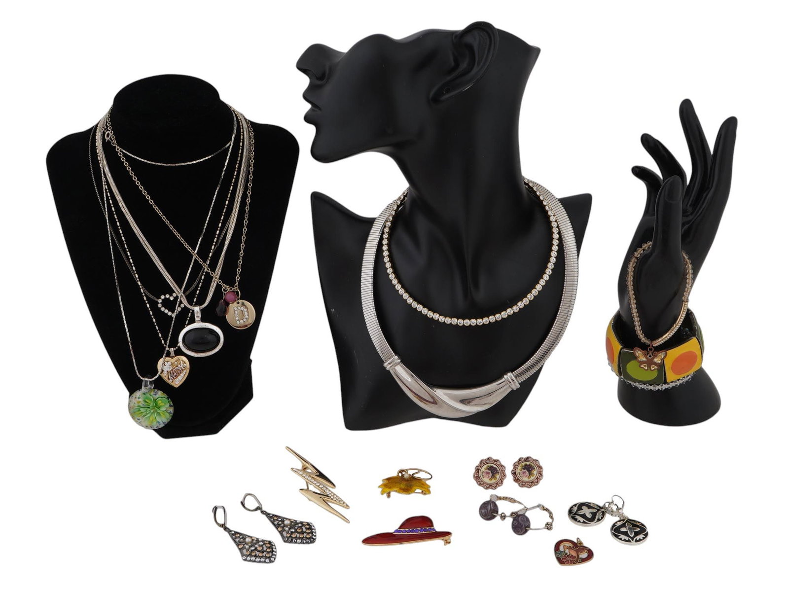 COLLECTION OF VINTAGE COSTUME JEWELRY PIECES: A collection of vintage costume jewelry pieces. Including necklaces with various pendants, various bracelets, brooches and various of earrings. Some are marked on the backside. Vintage and Modern Cost