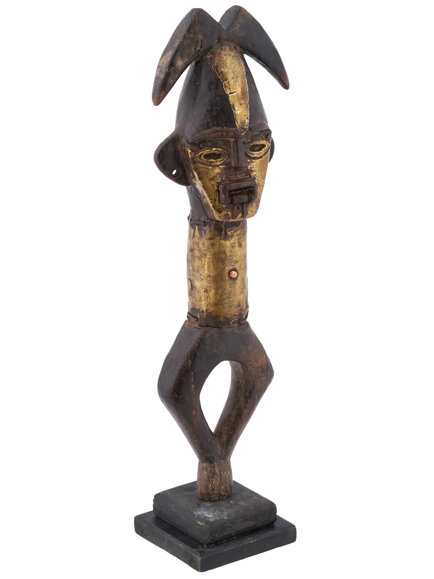AFRICAN KOTA PEOPLES OBAMBA GUARDIAN RELIQUARY FIGURE: A traditional Central African Kota peoples Obamba group reliquary wood figure of a guardian. Crafted from carved wood and adorned with gold tone painting, this figure serves as a guardian of ancestral