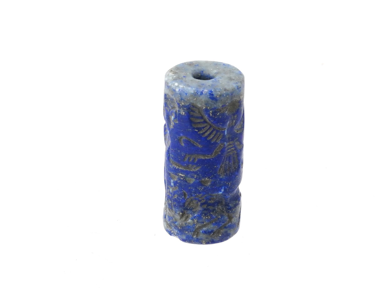 ANCIENT NEAR EASTERN CARVED STONE CYLINDER SEAL: An ancient Near Eastern carved stone cylinder seal showing human and animal figures. Cylinder seals were widely used in the ancient Near East as a form of personal identification and a means of authen