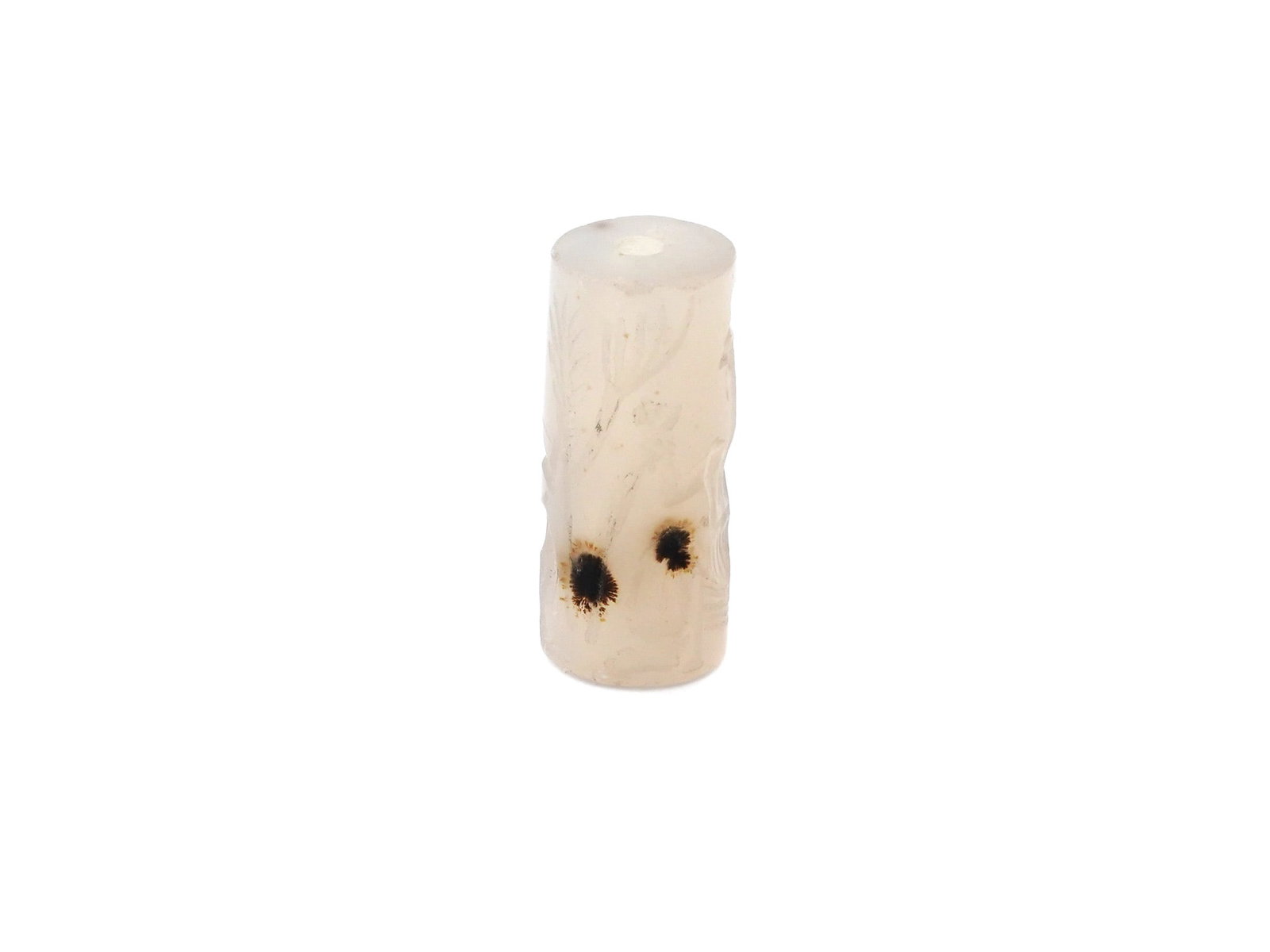 ANCIENT NEAR EASTERN CARVED STONE CYLINDER SEAL: An ancient Near Eastern carved stone cylinder seal showing human and animal figures. Cylinder seals were widely used in the ancient Near East as a form of personal identification and a means of authen