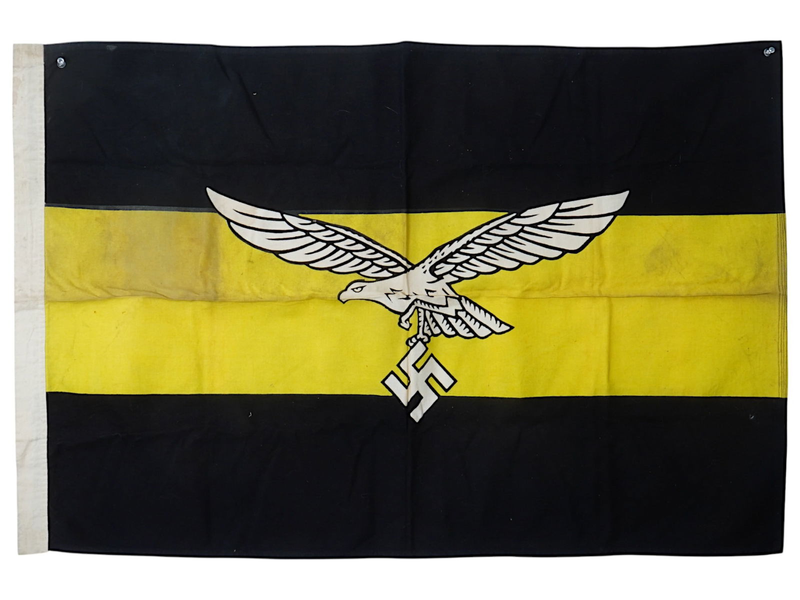 WWII NAZI GERMAN LUFTWAFFE RECONNAISSANCE COMMAND FLAG: A WWII Nazi German Luftwaffe Reconnaissance Command flag, designed with the iconic Luftwaffe flying eagle clutching a swastika in its talons. The flag features two black cloth panels on either side of