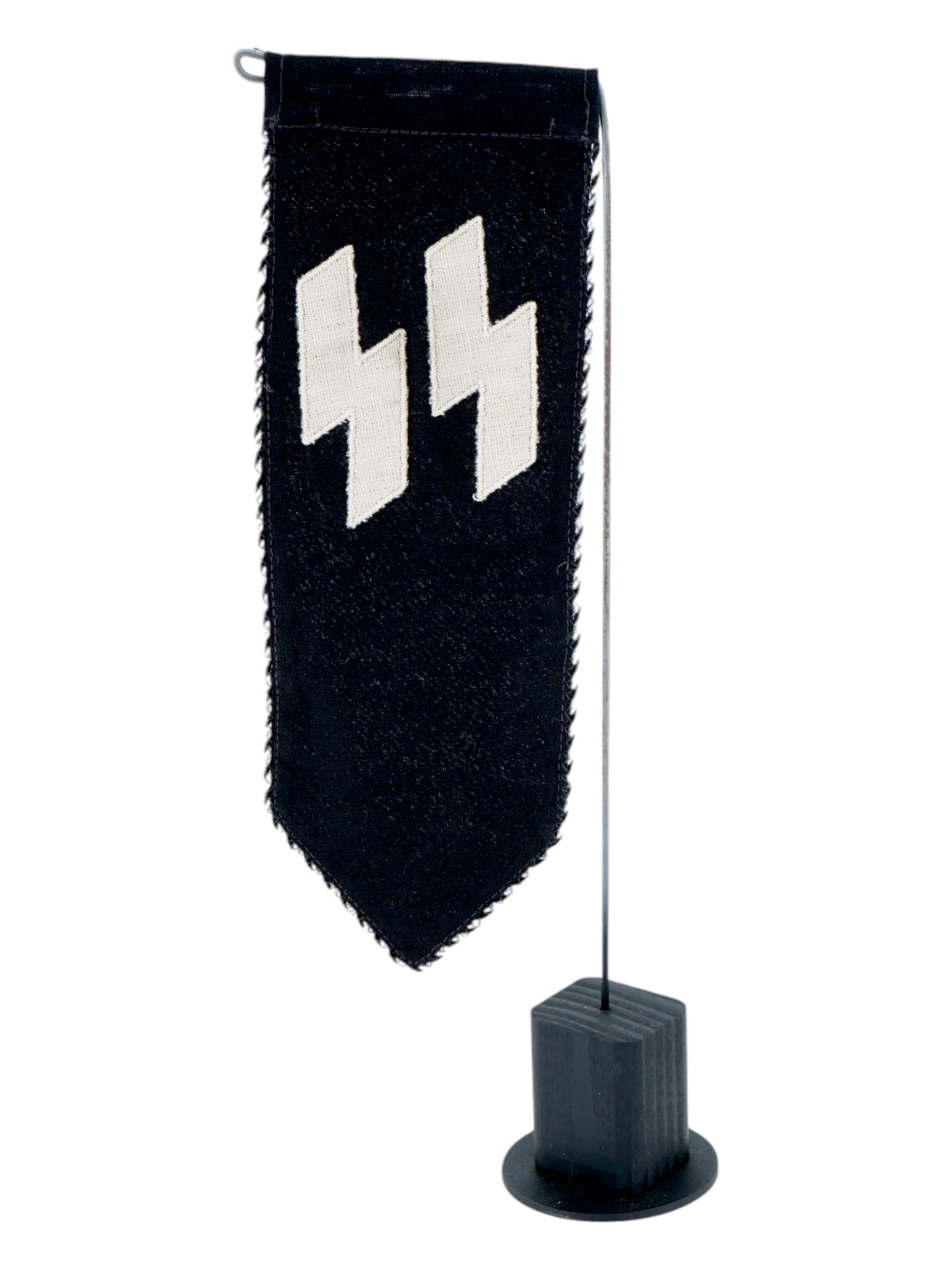 GERMAN WWII TYPE SS PENNANT ON THE TABLE STAND: A WWII Nazi German Third Reich Waffen SS black fabric pennant. The pennant is adorned with patches representing SS runes. Mounted on a table stand. Second World War German Third Reich Pennants and Fla