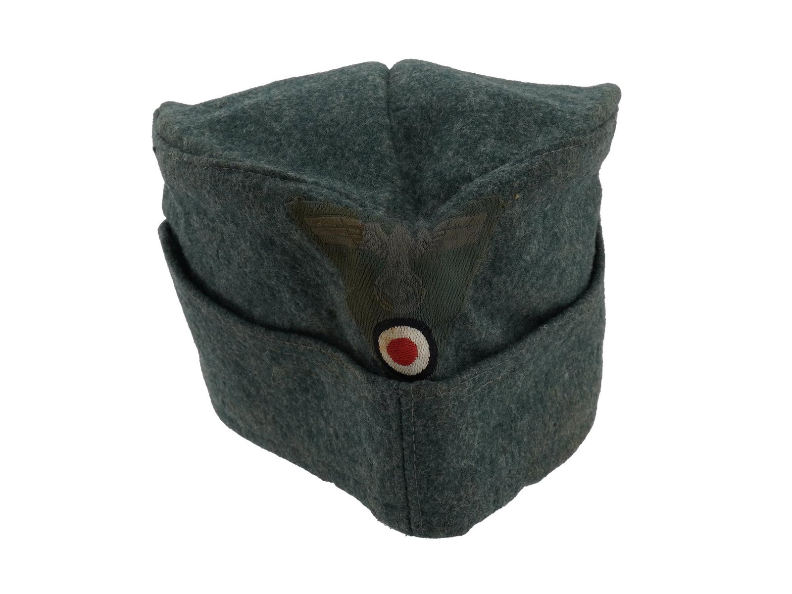 WWII ERA NAZI GERMAN THIRD REICH SOLDIER SIDE CAP: A WWII Nazi German Third Reich dark green grey wool side cap with a machine applied Eagle with swastika and insignia of tank forces are on the front. WW2 Era Collectibles, Nazi German Military Uniform