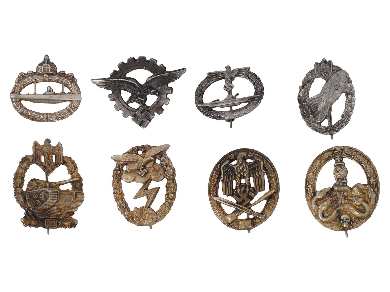 WWI AND WWII NAZI GERMAN MILITARY ARMY LUFTWAFFE BADGES: A group of seven WWII Nazi German badges, including the Army Tank Assault badge for 100 assaults, Luftwaffe Civilian Technician badge, Luftwaffe Ground Assault badge, Kriegsmarine U-Boat badge, Army G