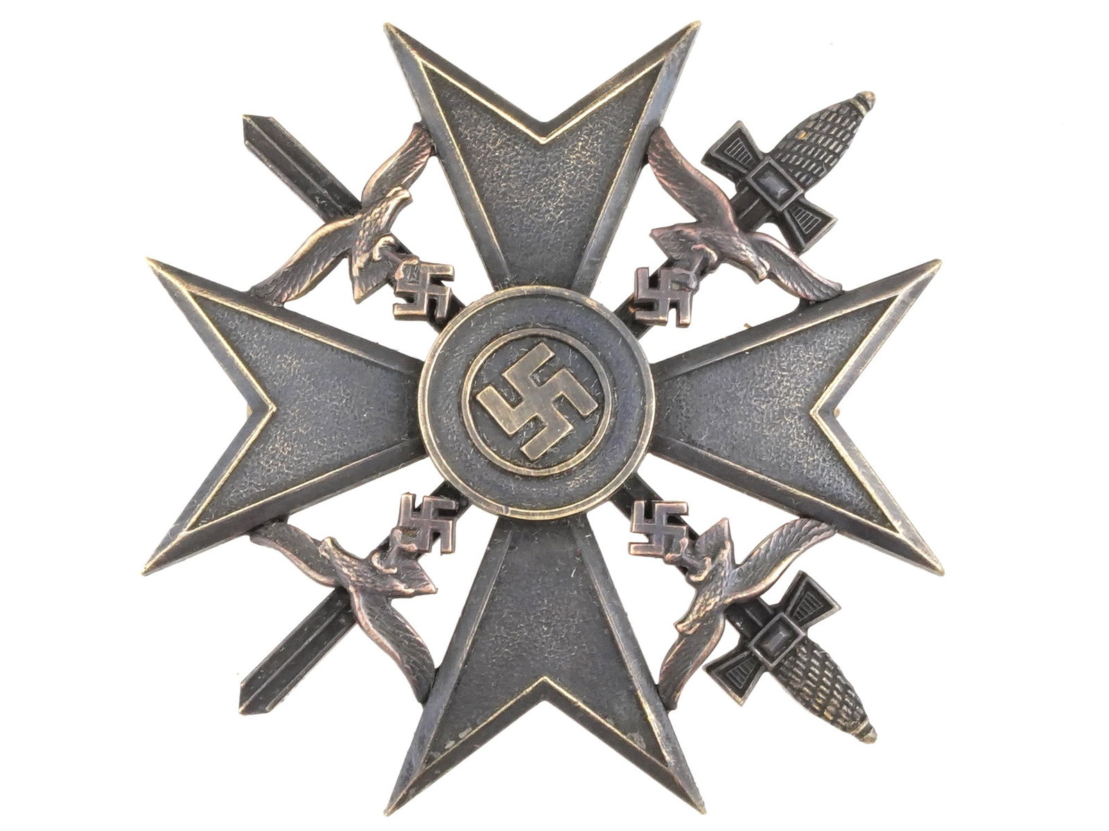 WWII NAZI GERMAN SPANISH CROSS WITH SWORDS BADGE: A WWII Nazi German Spanish Cross with swords given to participants in the Spanish Civil War, features a cross pattee form, similar in design to the German Iron Cross. The center of the cross bears a c