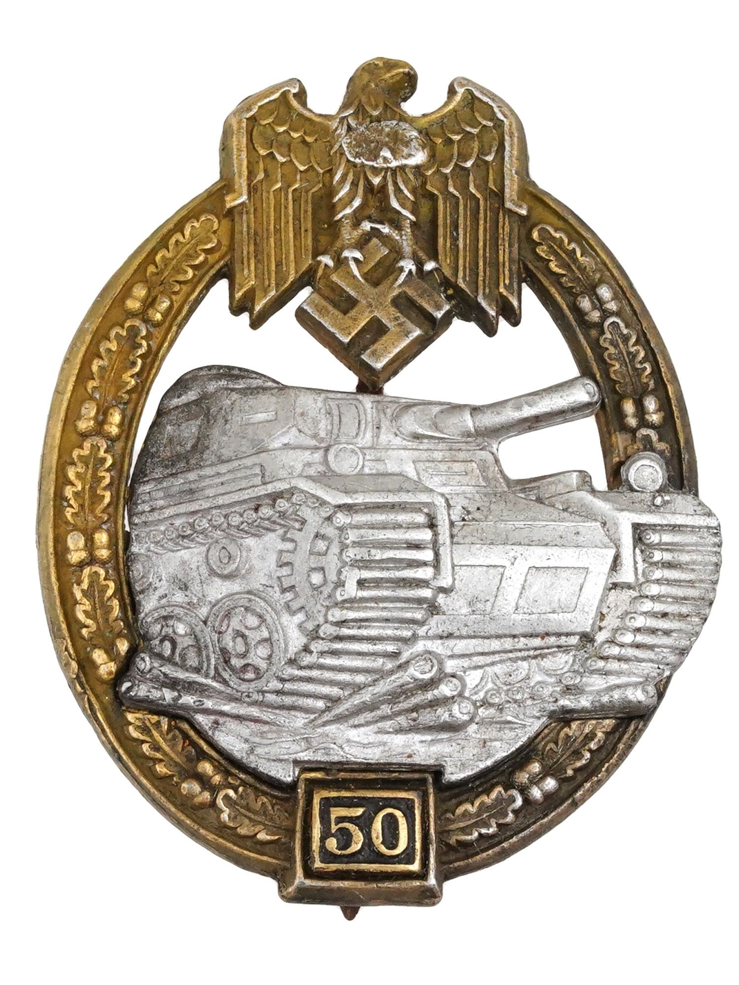 WWII NAZI GERMAN PANZER ASSAULT BADGE 50 ACTIONS: A WWII Nazi German Panzer assault badge, oval in shape, featuring a three-quarters front image of a Panzer IV tank, surrounded by an oak wreath and surmounted by the Wehrmacht eagle clutching a swasti