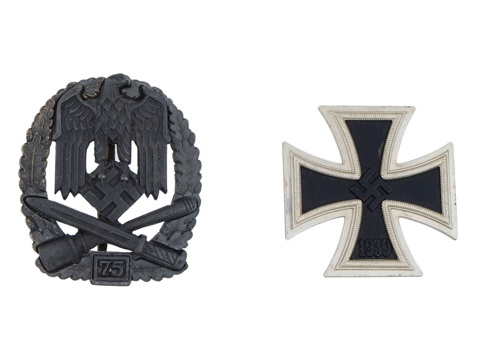 WWII NAZI GERMAN ASSAULT GENERAL AND IRON CROSS BADGES: A lot of two WWII Nazi German badges including Assault General Badge given for 75 assaults, featuring a prominent Wehrmacht style eagle grasping a swastika, crossed bayonet, and stick grenade within t