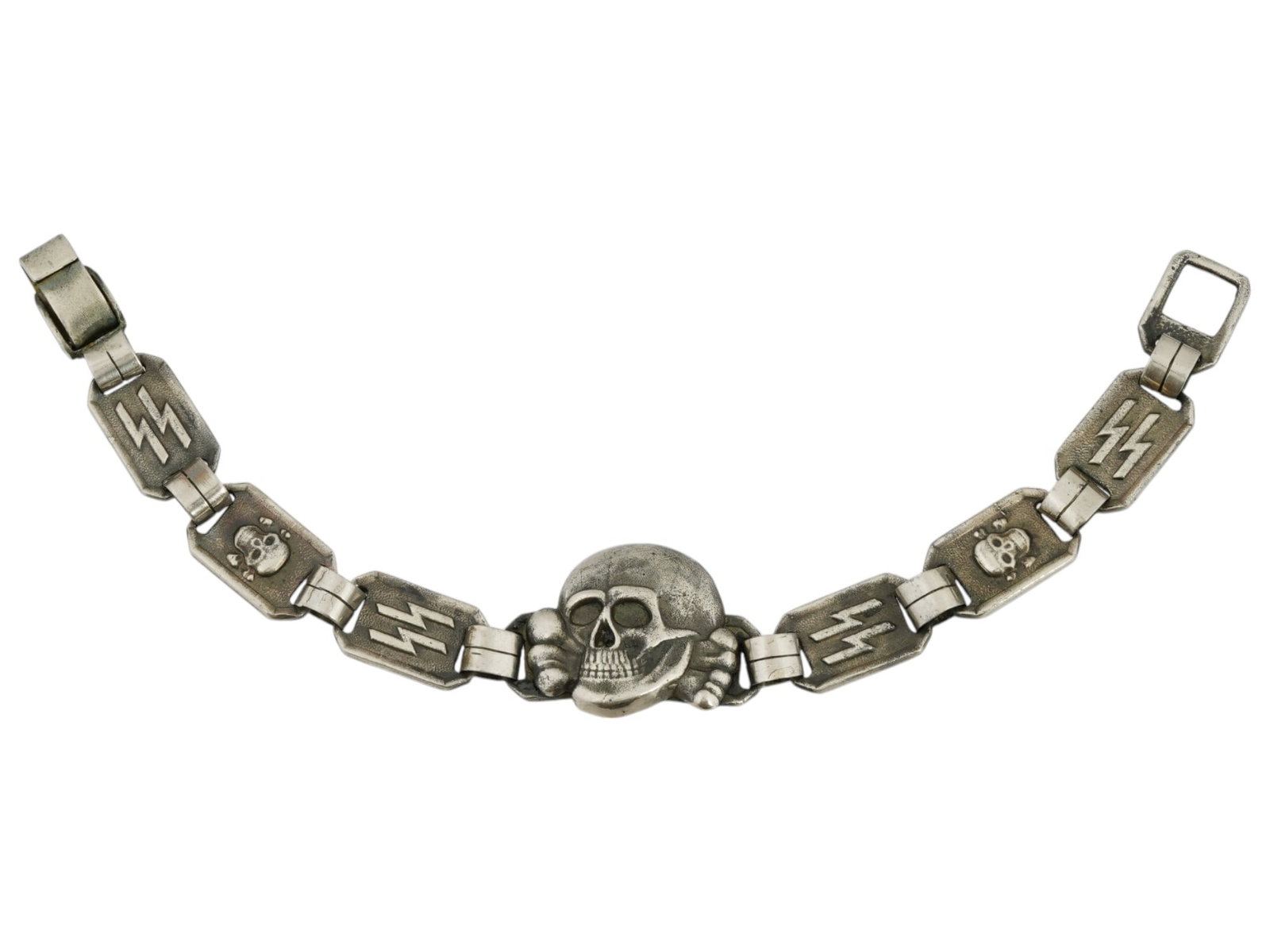 WWII MODEL NAZI GERMAN WAFFEN SS TOTENKOPF BRACELET: A WWII model Nazi German Waffen SS bracelet manufactured in a link design. The links are decorated with relief images of Totenkopf skulls and SS runes. The central link represents the relief Totenkopf