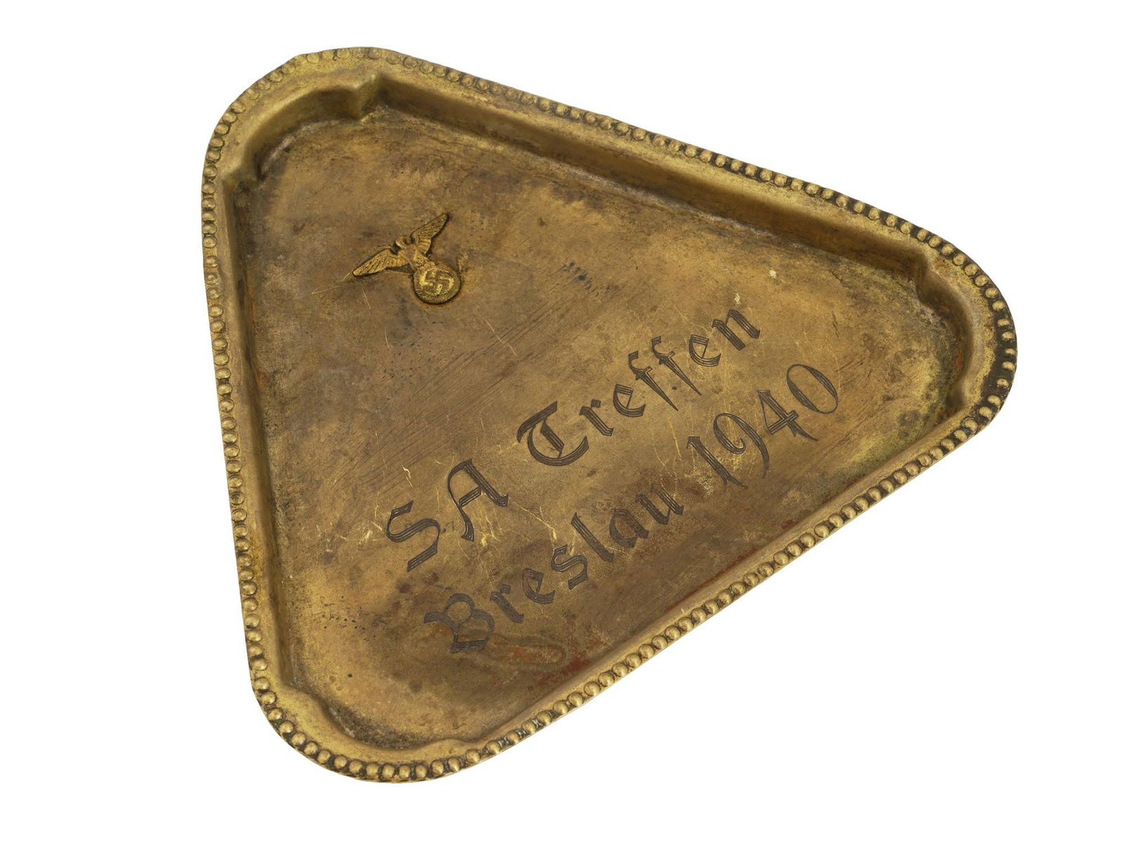 WWII GERMAN TRIANGULAR TRAY SA TREFFEN BRESLAU 1940: A WWII Nazi German triangular tray featuring a beaded rim and central engraving reading SA Treffen Breslau 1940, positioned below a raised Nazi eagle in relief. Nazi German Trays And Second World War