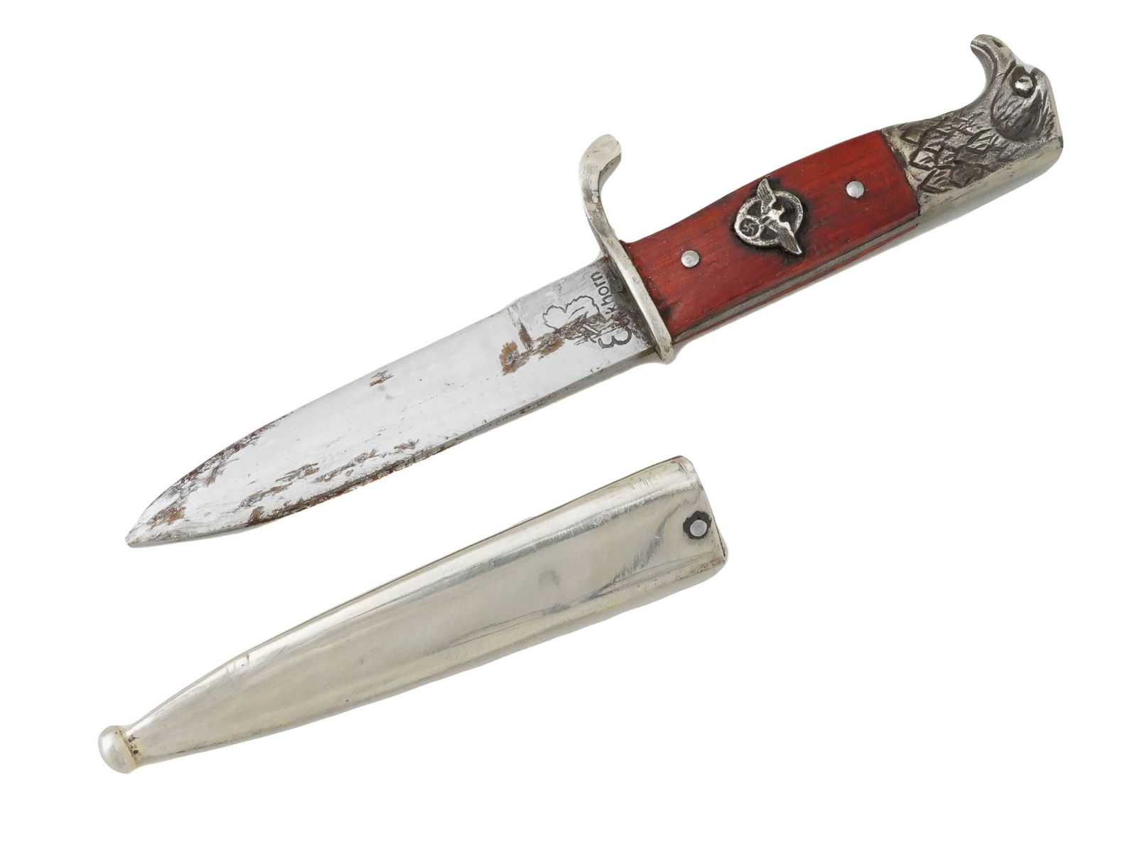 GERMAN WWII MINIATURE DRESS POLICE BAYONET: A Second World War Nazi German type miniature dress police bayonet featuring a nickel plated blade. The handle features an eagle head pommel with finely engraved details. The grip has dark cherry red